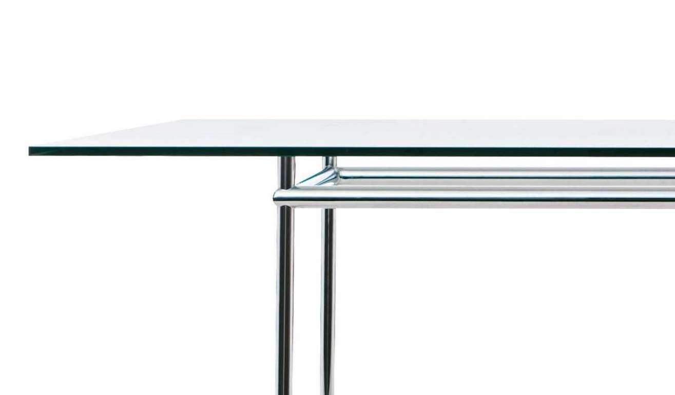 Price is dependent on the chosen size and materials. Available in 120 X 80 OR 160 X 120. The Top is available in American Walnut, Natural Oak or Black stained Oak. The metal base is available in chrome or light blue. 

Table designed by Le