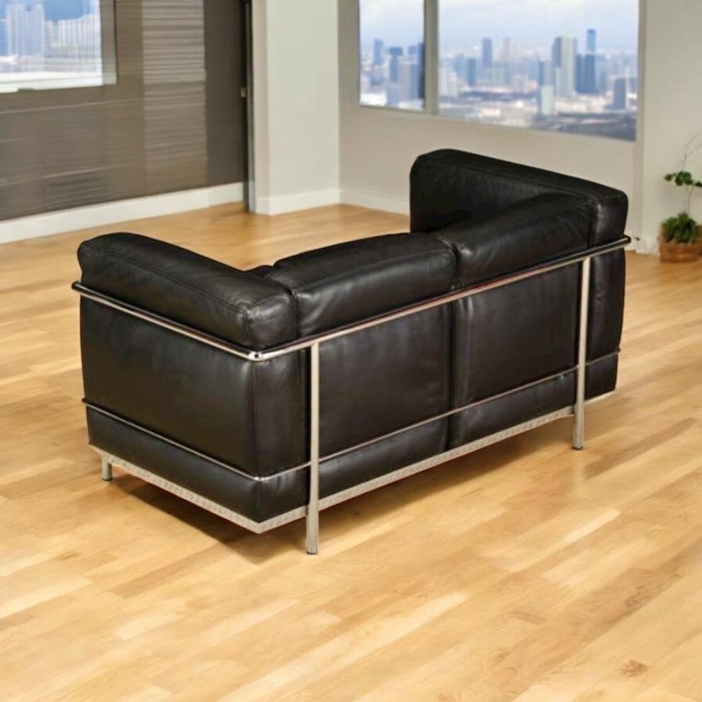 This incredibly comfortable Le Corbusier for Cassina 'LC2' two-seat loveseat sofa, signed (see pics, in gorgeous thick Italian black leather on chrome steel frame is in beautiful vintage condition with light patina and ready to be immediately placed