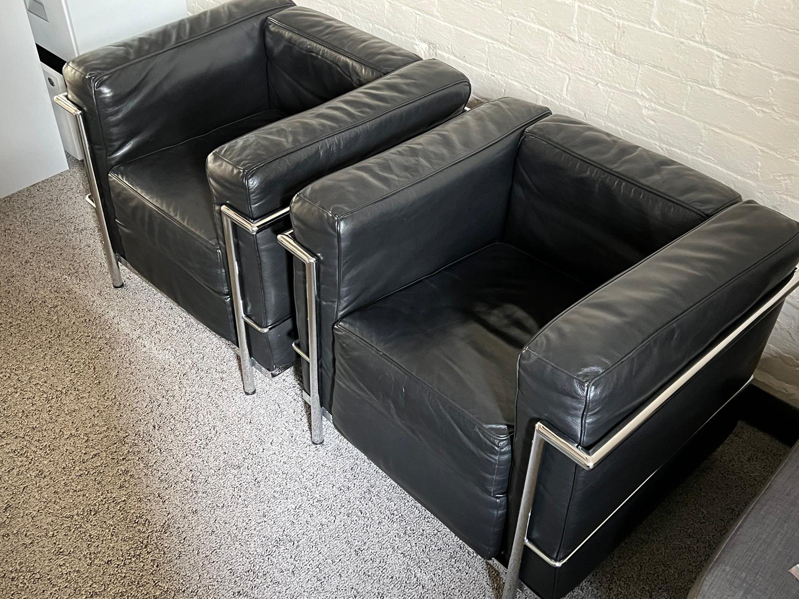 Exclusive LC2 armchair designed by Le Corbusier, Pierre Jeanneret and Charlotte Perriand for Conran. Designed in 1928 with a chrome tube frame and soft black leather. 

Iconic club chairs that have stood the test of time. Manufactured in 1998 and