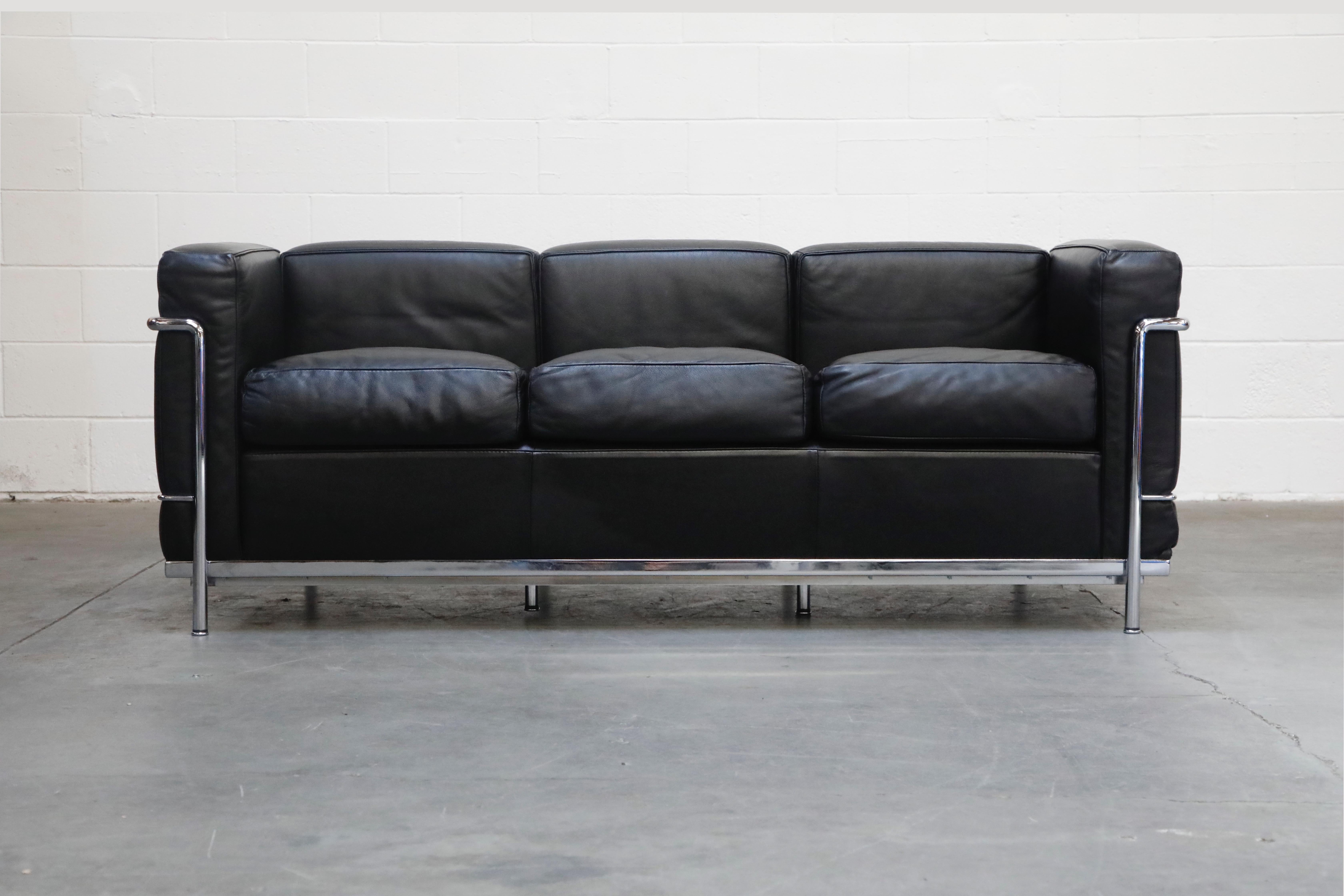 This incredibly comfortable Le Corbusier for Cassina (authentic signed) LC2 three-seat sofa in gorgeous thick Italian black leather and tubular chrome frame. We also have the matching pair of club chairs in another listing, contact us or see our
