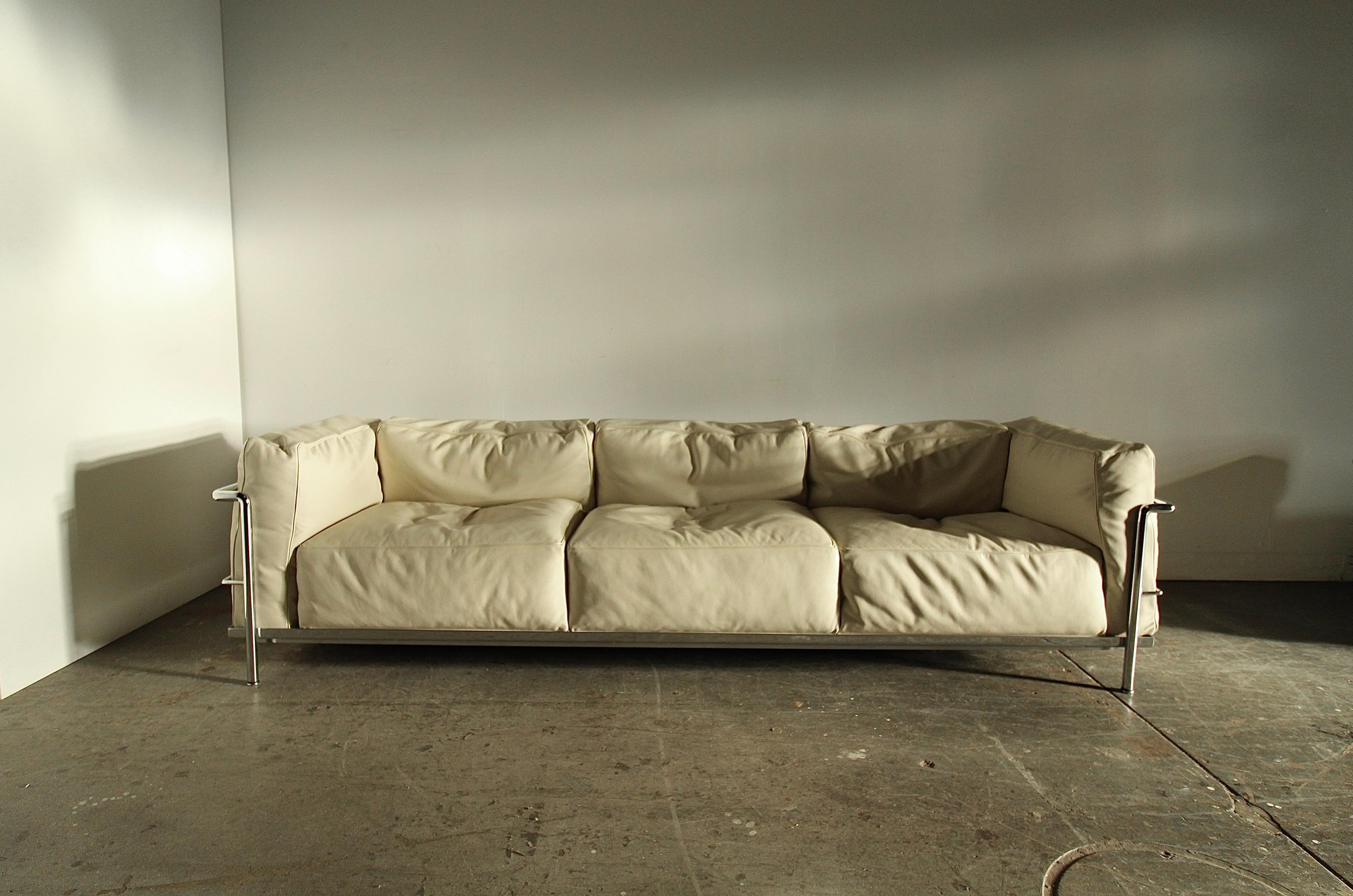 A magnificent and luxurious LC3 Grand Modele sofa by Le Corbusier, Pierre Jeanneret, and Charlotte Perriand for Cassina, circa late 90's. Upholstered in thick, full-grain, leather with 70% feather down cushions for maximum body enveloping comfort
