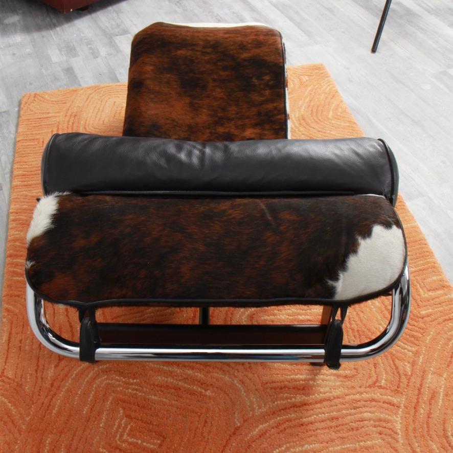 A very clean LC4 chair in cowhide purchased at Design Within Reach about 15 years ago. Most likely made by Cassina, but without stamp.since Cassina did not start branding their chairs until 2010. Cowhide, frame and leather headrest look near new.