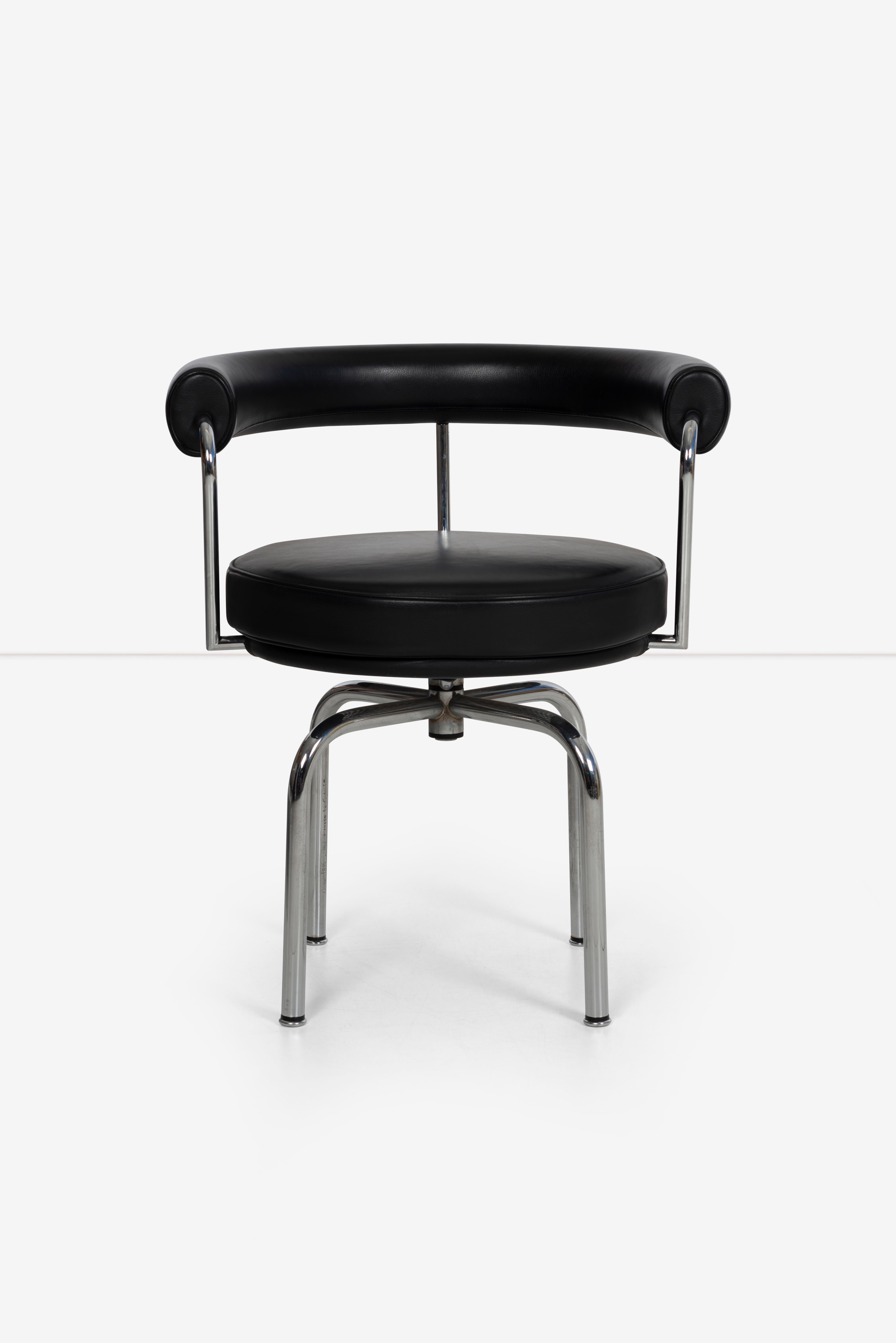 LC7 swivel chair designed by Charloette Perriand. Chrome plated steel and black leather. minor pitting to the base. Originally designed in 1928 for her apartment.