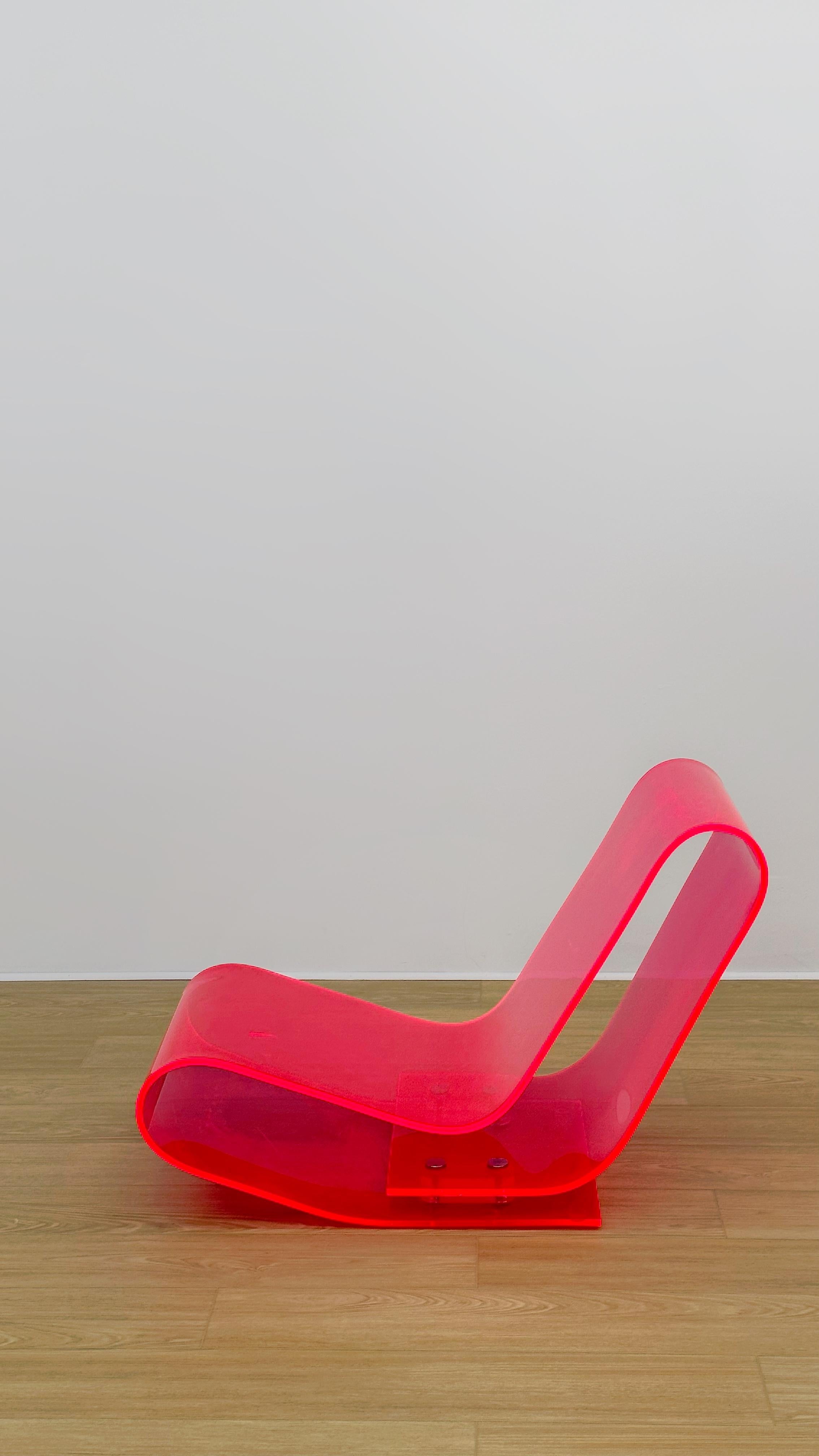 Italy, 2001. Batch-dyed PMMA molded into an open loop that folds back on itself. The plastic evolution of the designer’s 1993 LC95A aluminum chair. Originally produced in clear, neon pink, neon yellow and blue, only clear remains in production today.