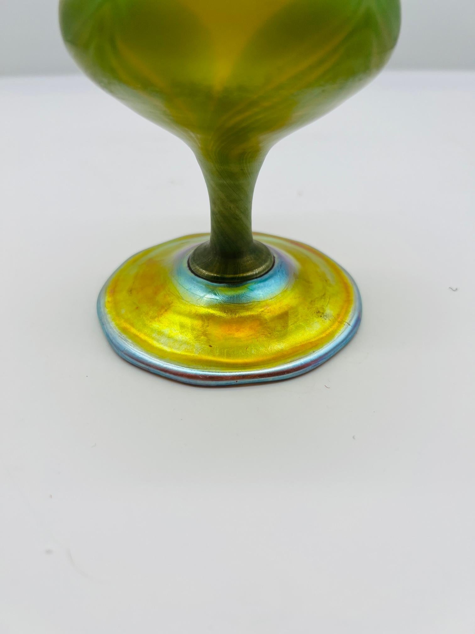 A beautiful antique LCT Tiffany Studios favrile art glass feather pulled vase that has been cut down into a goblet. Marked to the underside. 