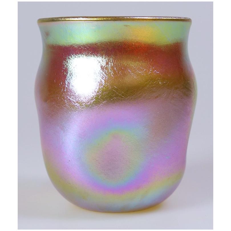 Offering this diminutive Louis Comfort Tiffany gold Favrile iridescent art glass cordial glass that may also be used as a toothpick holder / shot glass. This cordial features a square rounded body with 