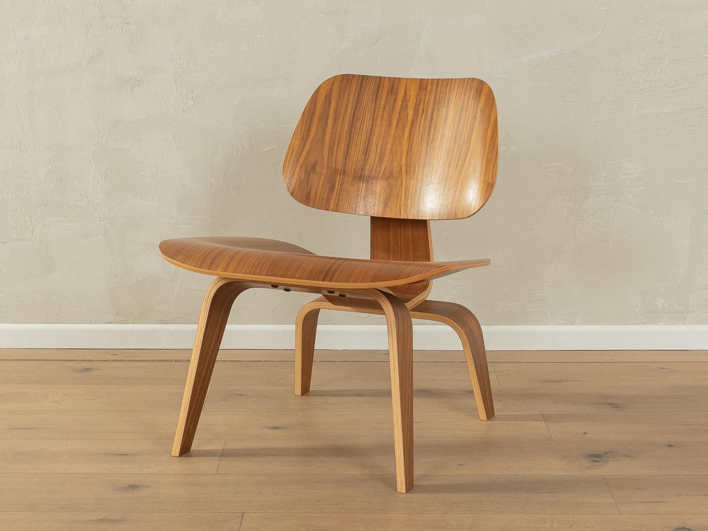 

Classic LCW lounge chair by Charles & Ray Eames for Herman Miller from the 1940s. Corpus made of bent ash plywood in walnut venier.

Quality Features:

    accomplished design: perfect proportions and visible attention to detail
    high quality