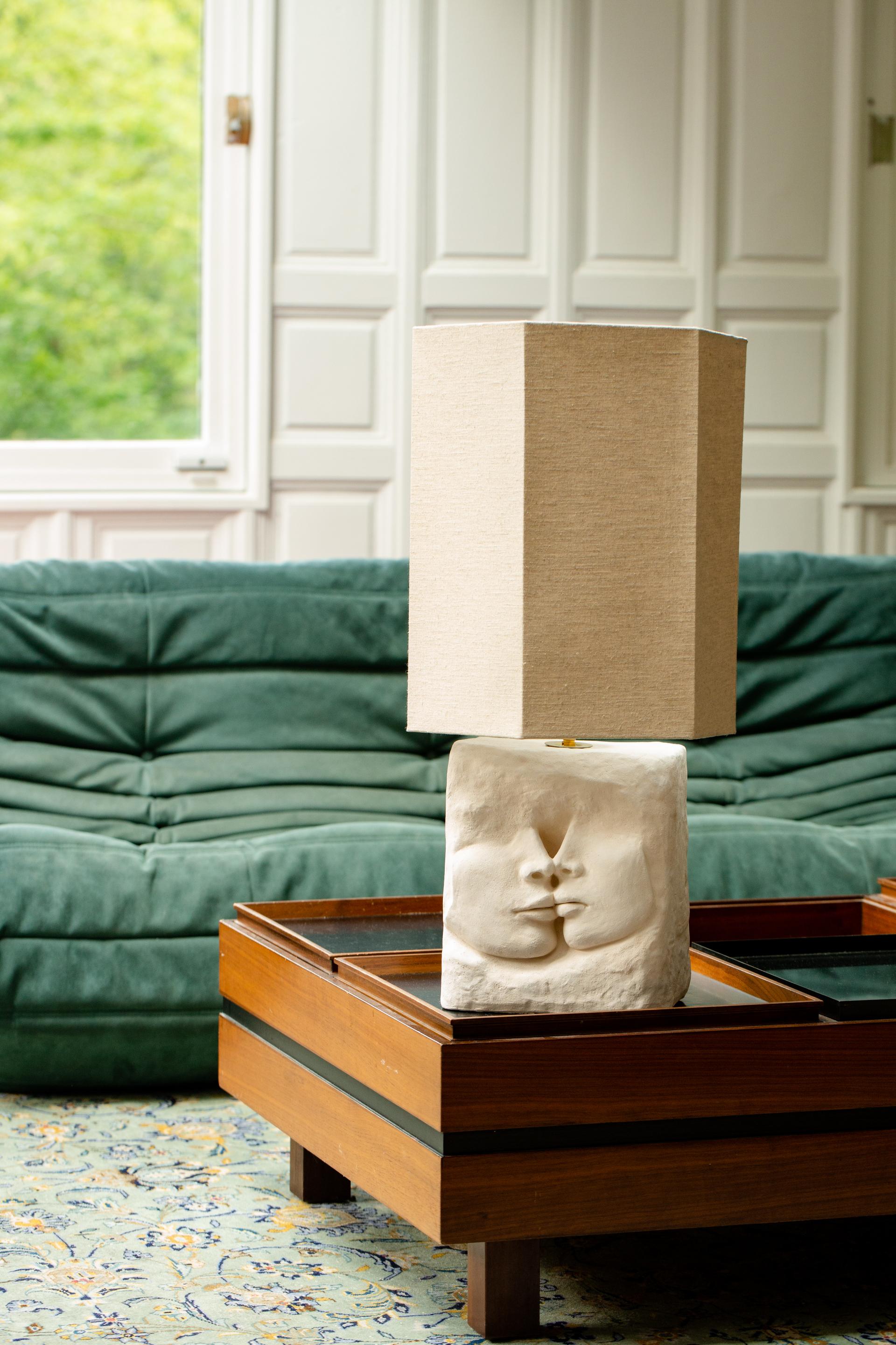 Le Baiser Table Lamp by Di Fretto
Dimensions: W 25 x D 15 x H 30 cm (measure without lampshade)
Materials: White Faience (not glazed / without the lampshade)

Lampshade - On Demand

The Le Baiser table lamp, when bas relief becomes a source of light