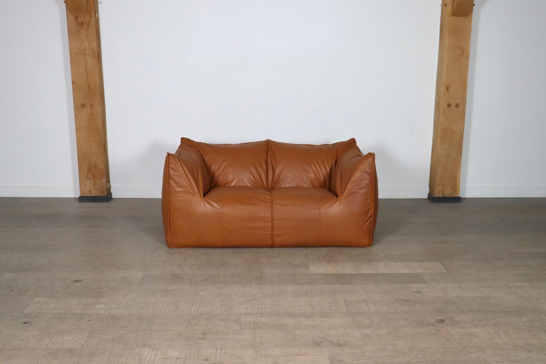 Stunning “Le Bambole” two seater sofa designed by Mario Bellini for B & B Italia in the 1970s. A beautiful edition in cognac leather. Besides the outstanding comfort this iconic sofa is famous for its timeless looks. The ‘Le Bambole’ collection was