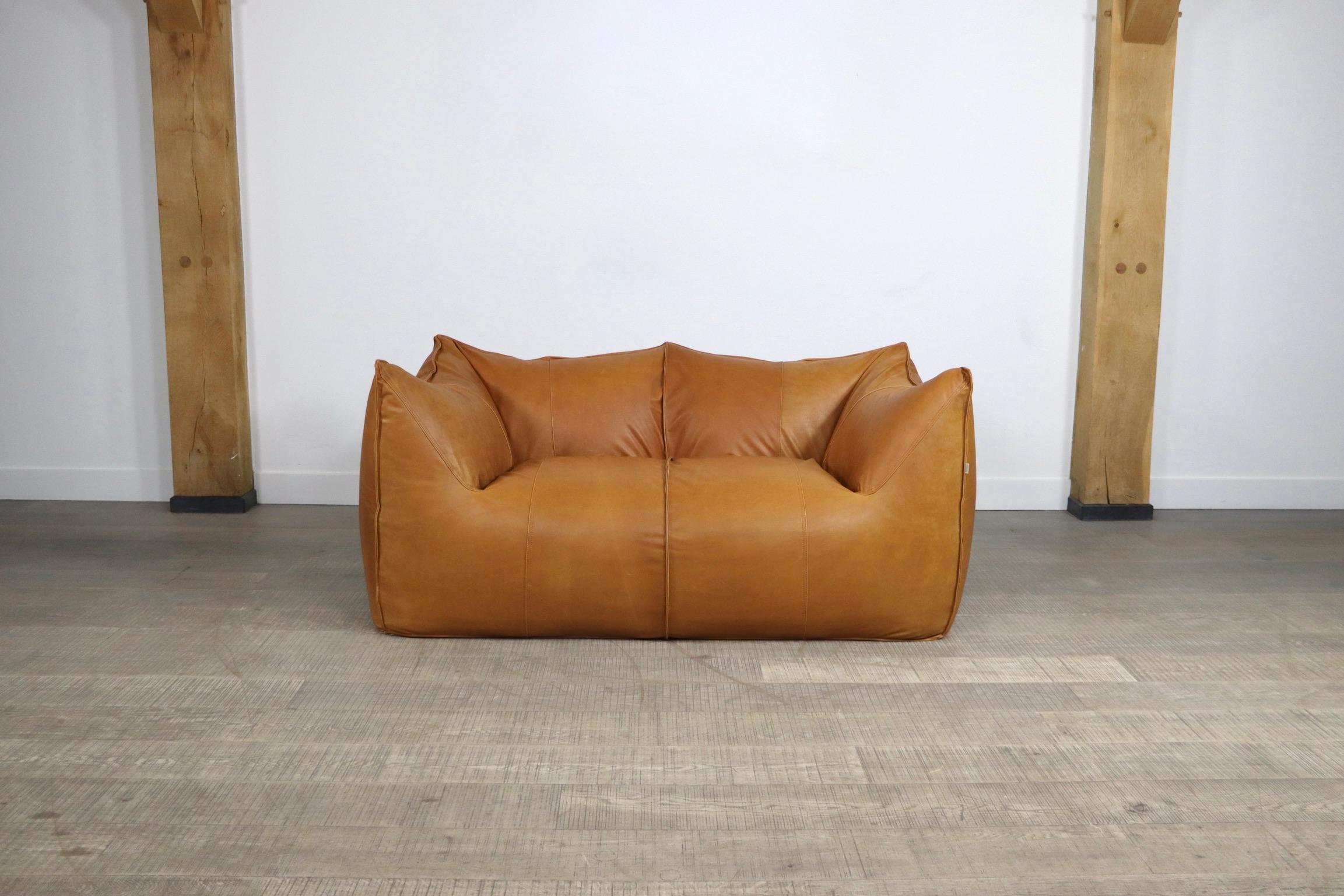 Stunning “Le Bambole” two seater sofa designed by Mario Bellini for B & B Italia in the 1970s. A beautiful edition in cognac leather. Besides the outstanding comfort this iconic sofa is famous for its timeless looks. 

Dimensions: W178 x D98 x H72