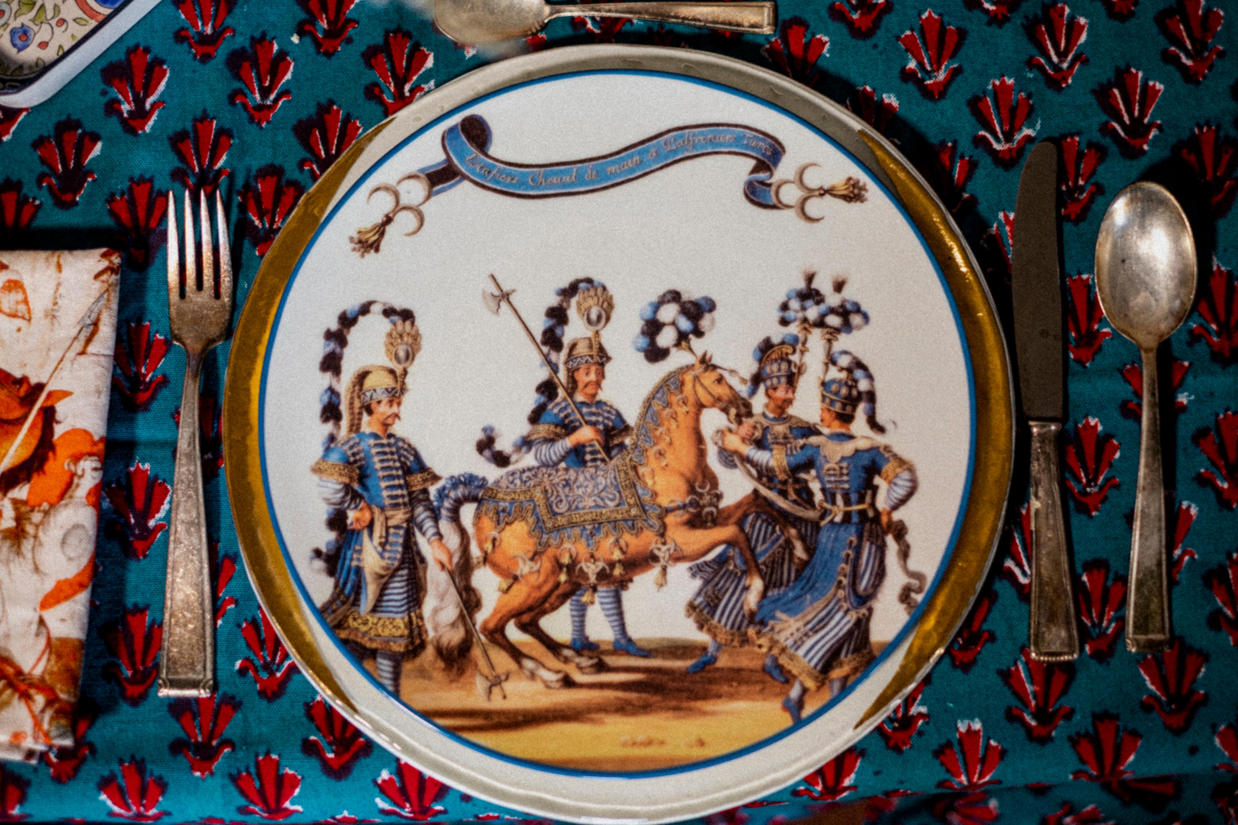 An hommage to the Carousel that the king Louis XIV gave to the Louvre for the birth of his son. 
The Turkish caracthers were very well represented by the 'noblesse' of the Kingdom in a sort of revisited Turquerie.