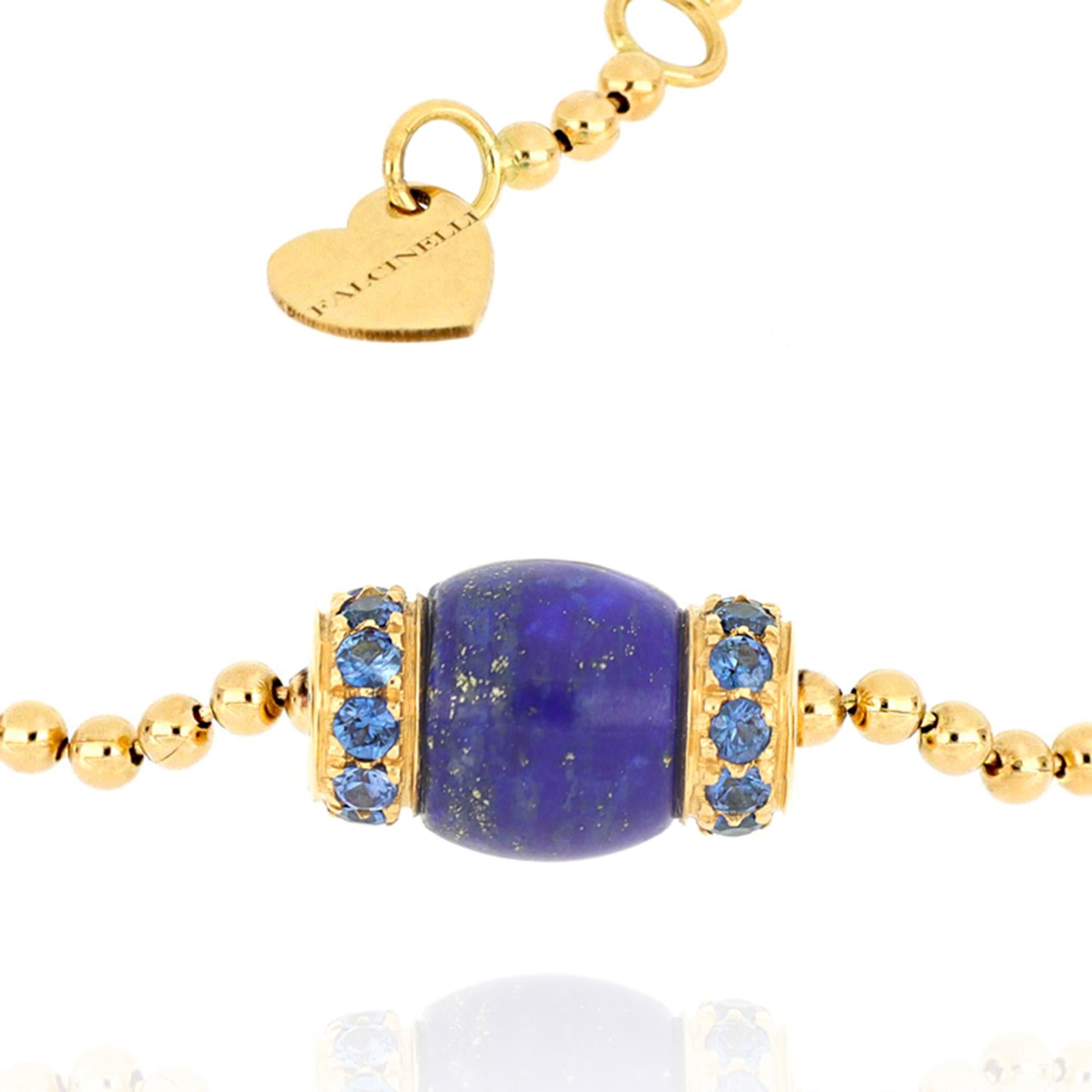 The 18 karat yellow gold ball chain, light and comfortable on the skin, reveals all the craftsmanship with which this bracelet from Le Carrousel collection was designed. The barrel-shaped central pendant is enhanced by the deep color of lapis lazuli