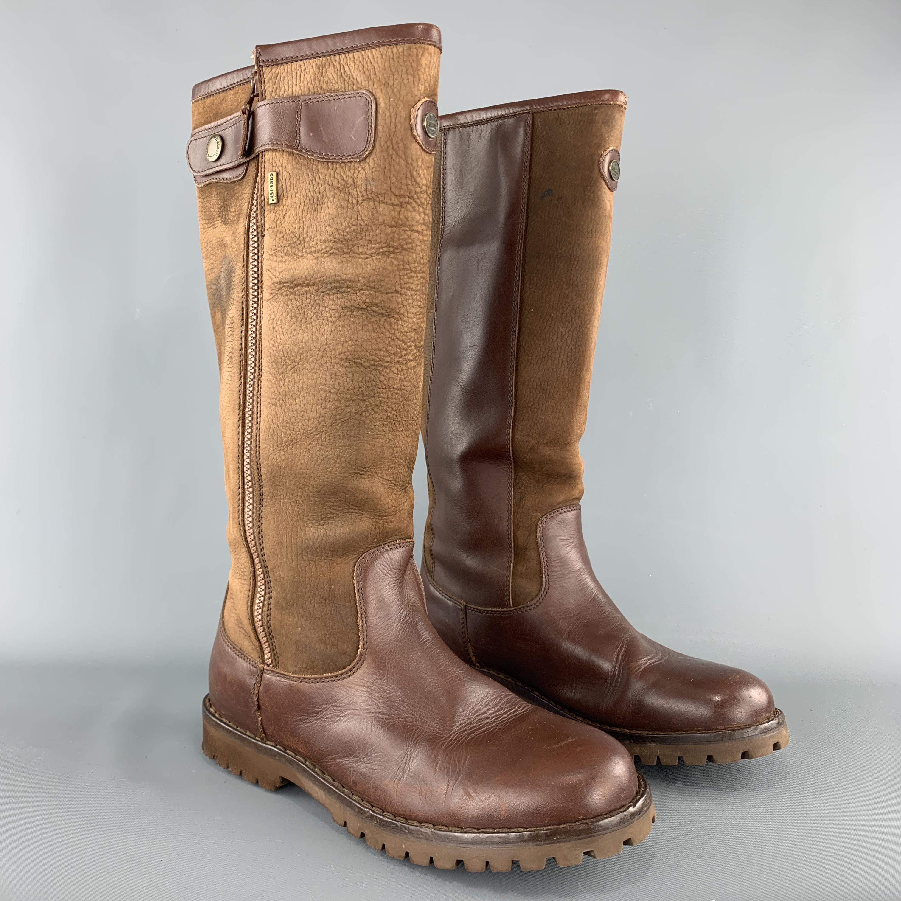LE CHAMEAU work boots come in brown leather with tan textured leather shaft, wide zips, and rubber soles. Includes storage bag. Wear throughout. As-is. Made in Portugal.

Fair Pre-Owned Condition.
Marked: US 9.5

Outsole: 11.75 x 4.25 in.
Length: 16