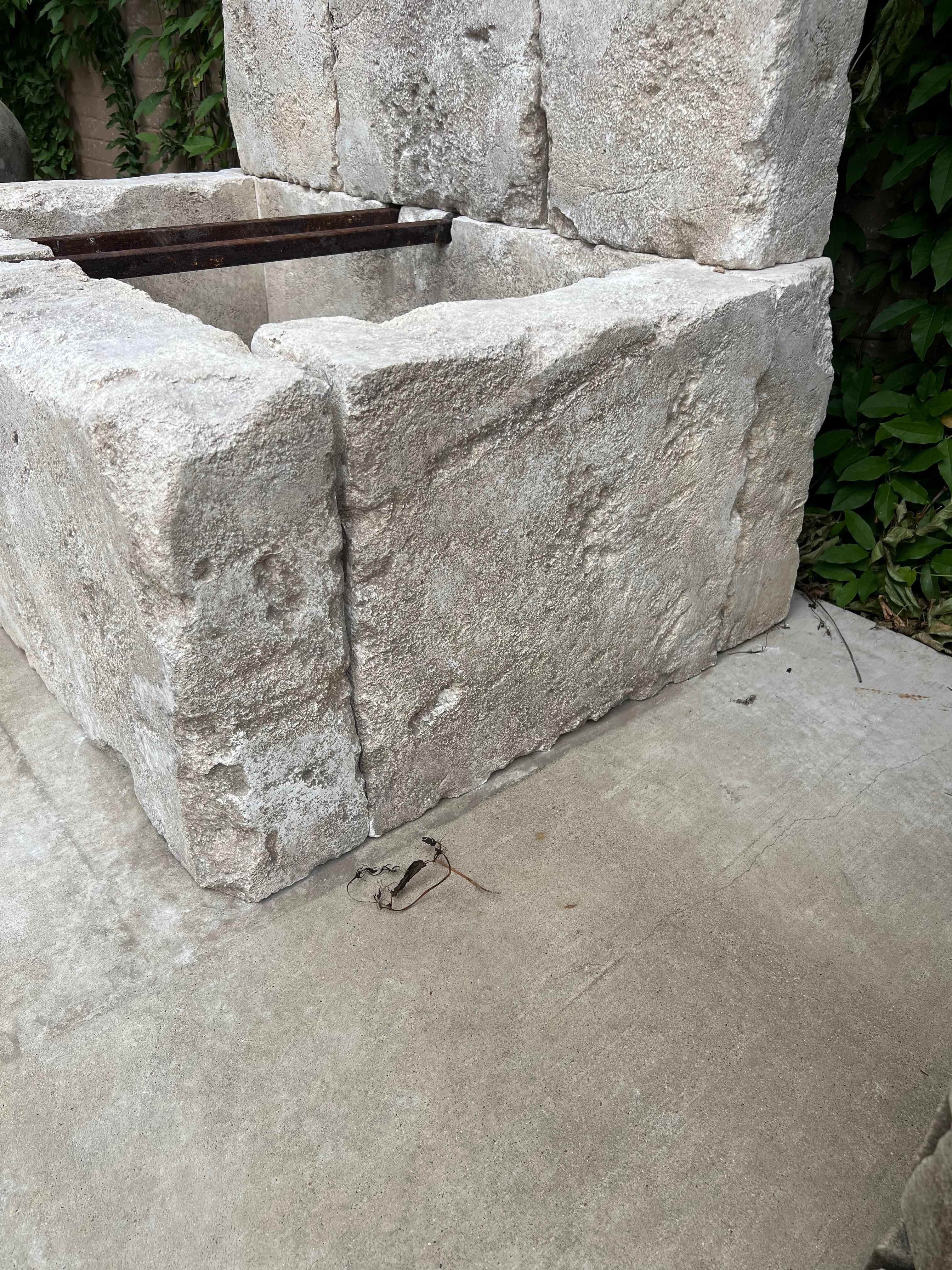 French Le Chaux Hand Carved and Distressed Limestone Block Fountain, South of France For Sale