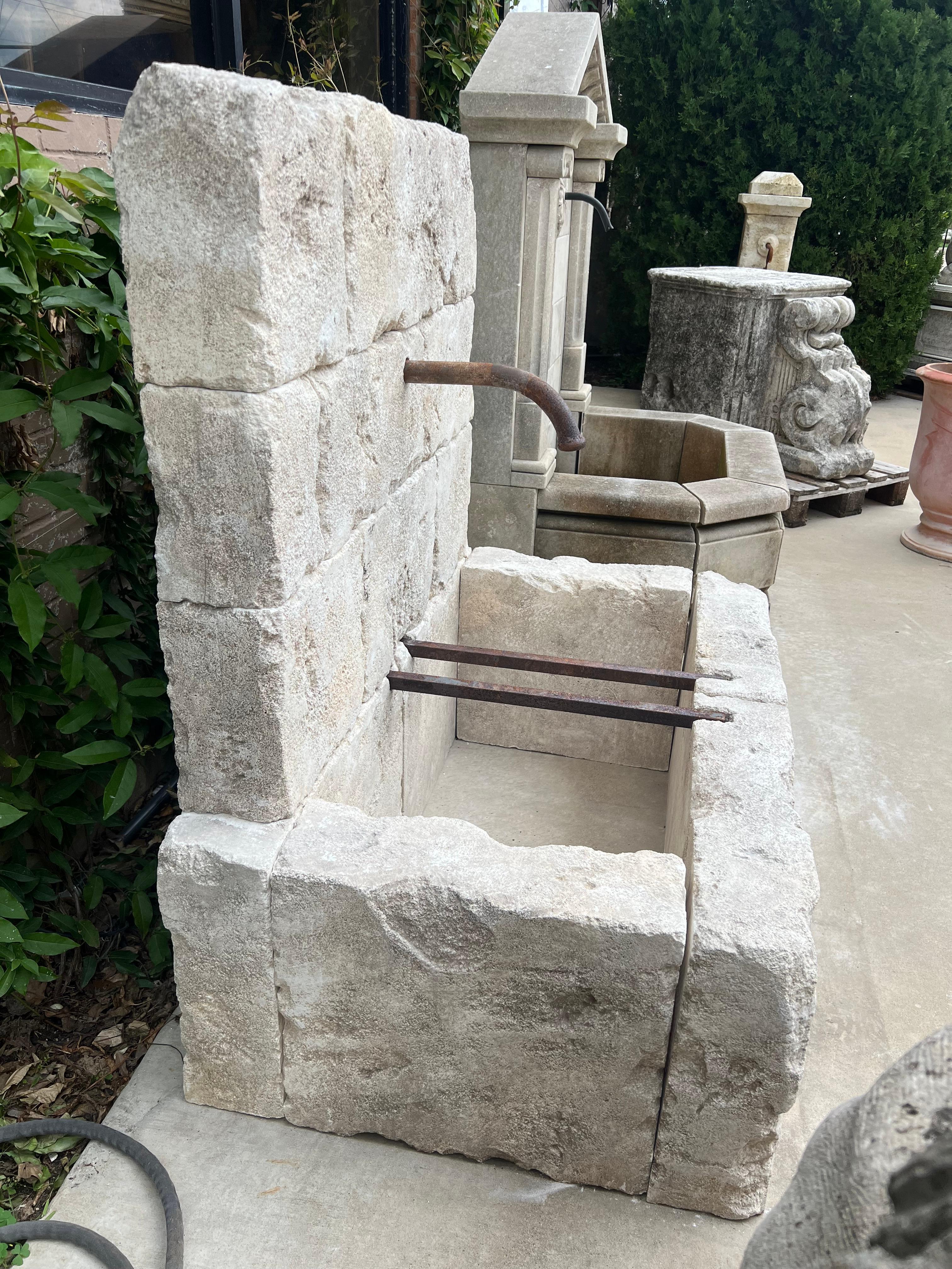 Le Chaux Hand Carved and Distressed Limestone Block Fountain, South of France For Sale 1