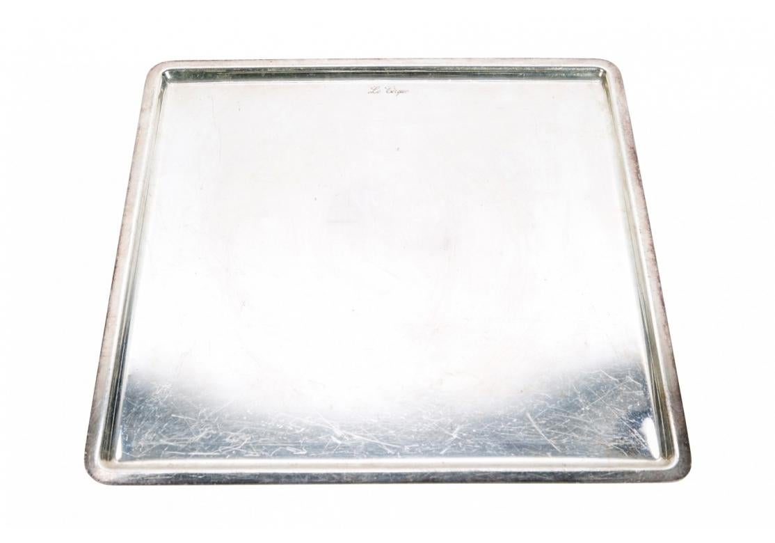 Le Cirque engraved hotel silver square weighty serving tray from the original Le Cirque - Le Cirque is engraved at the top. Marked on verso L.A.G. Di Ricciarelli, made in Sesto Fiorentino, Italy.
Dimensions: 12 1/2