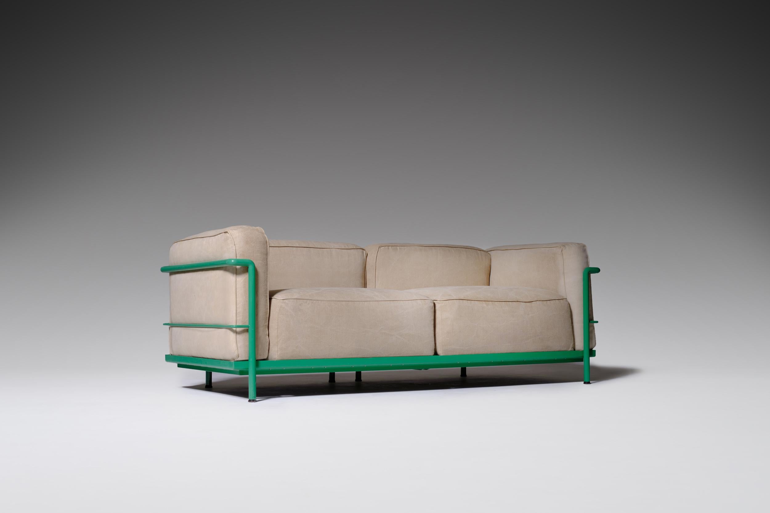 LC3 two-seat sofa by Le Corbusier, Charlotte Perriand and Pierre Jeanneret, originally designed in 1928. This particular one is produced by Cassina in 1965. Special edition constructed out of a bright green lacquered tubular steel frame and natural