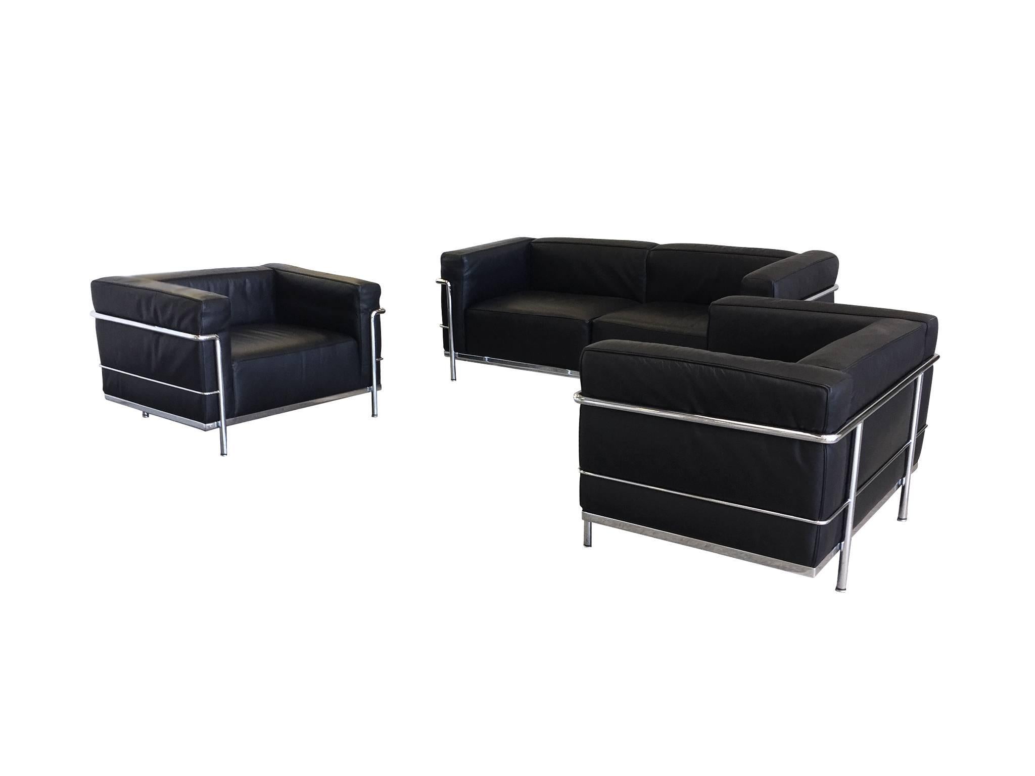 These Bauhaus LC3 sofa and club chairs have become iconic modern designs. Conceived by Le Corbusier, Pierre Jeanneret, and Charlotte Perriand and produced by Cassina, they are minimalist versions of traditional sofas and club chairs. The frame is