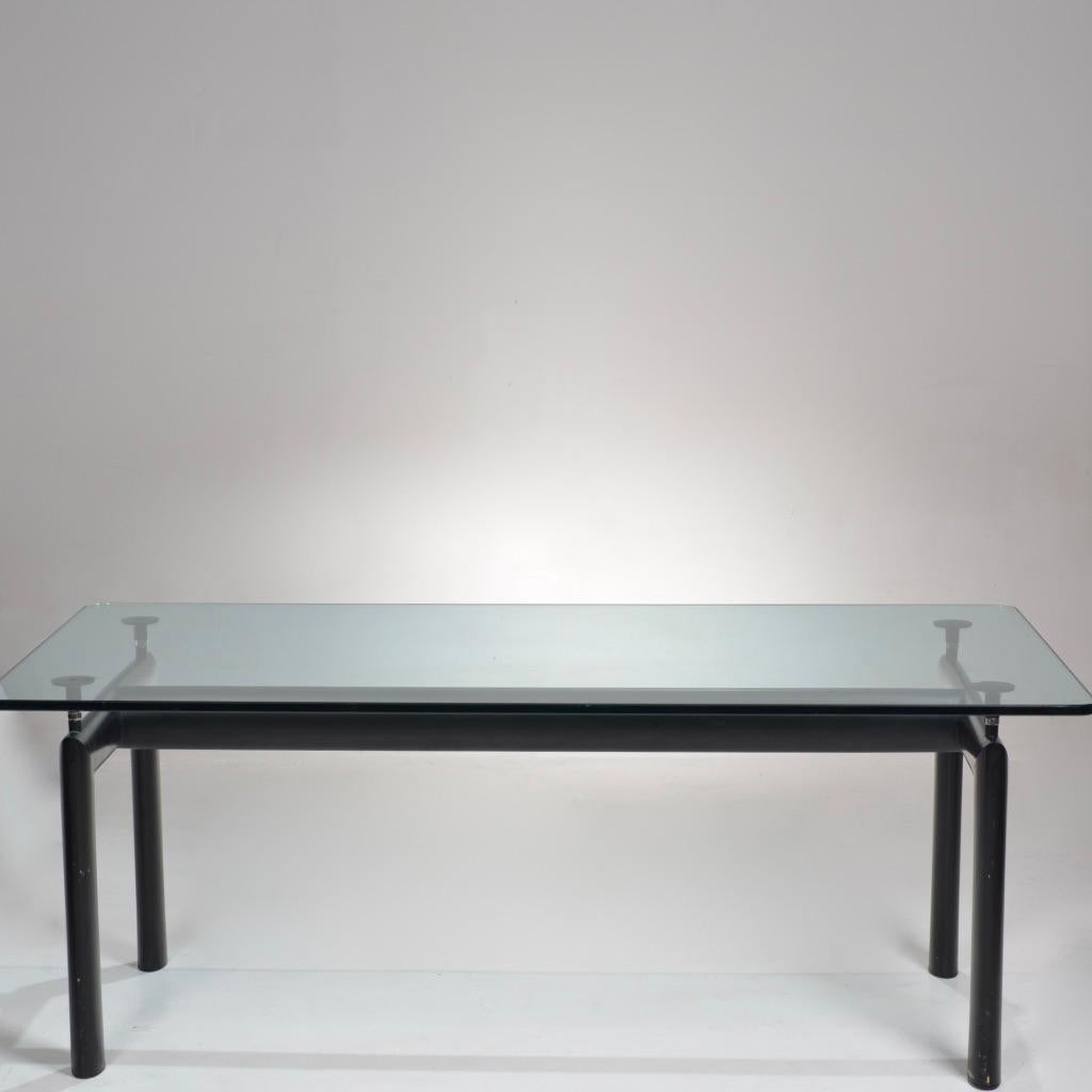 The LC6 table was originally designed in 1928, a mathematically refined structure of steel and glass. Made of aeronautical steel, the base is welded for a seamless finish with sculpted angles and smooth, mitered corners.
The table top is a