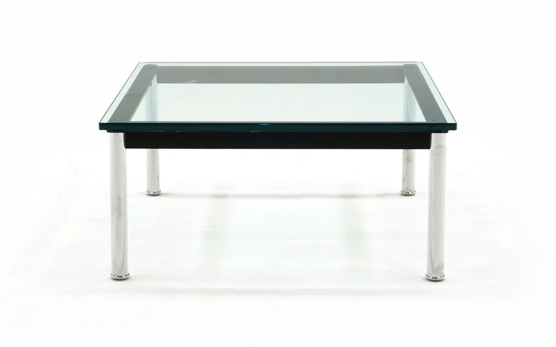 LC10-P coffee table or end table designed by Le Corbusier, Pierre Jeanneret, Charlotte Perriand and manufactured by Cassina, Italy. This example was purchased new five years ago. Glass top with chromed steel legs and black steel frame. No chips or