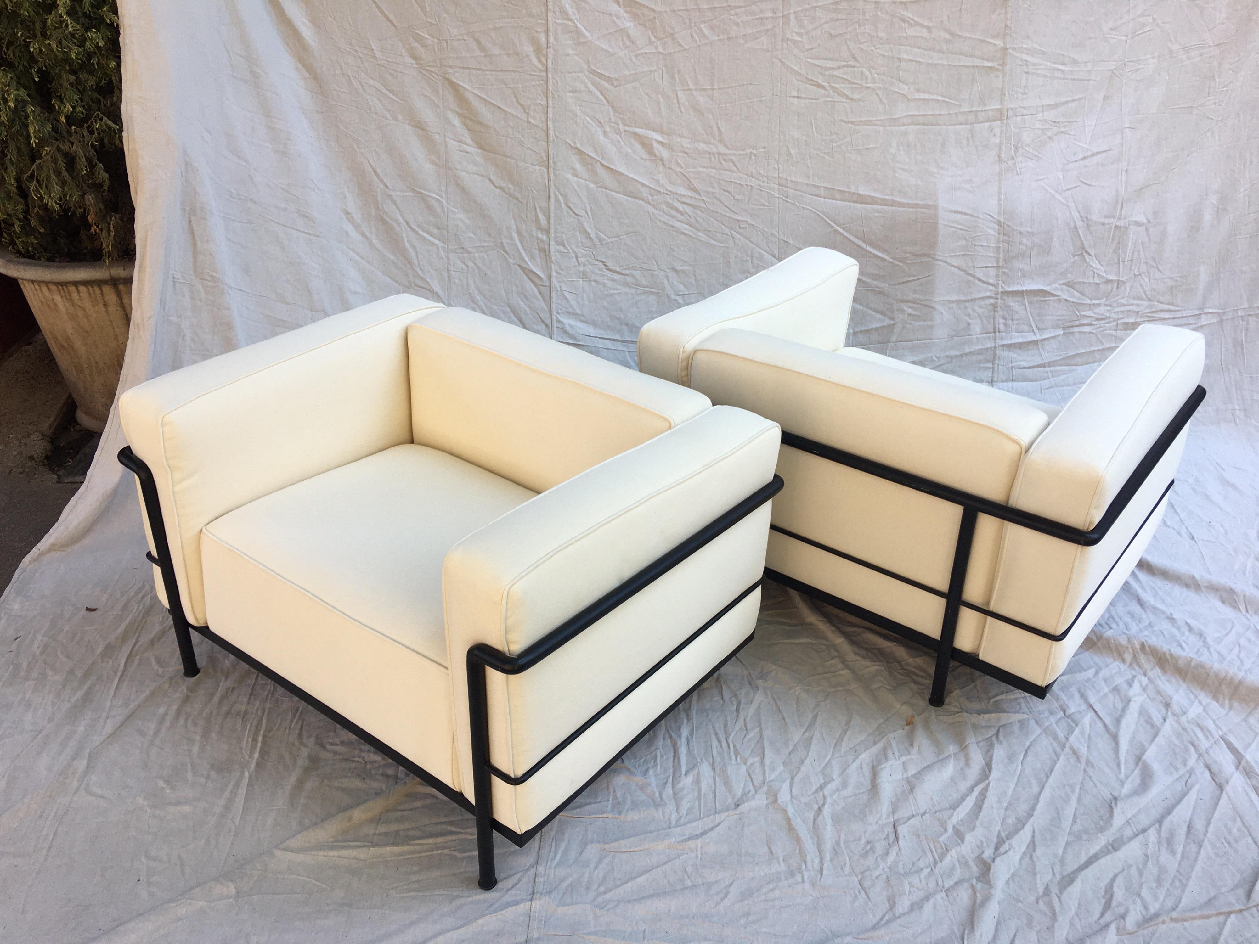 Le Corbusier LC-3 lounge chairs for Cassina in an off white canvas. Newly recovered cushions, with the original Cassina bottom ticking. Blacks frames show very minimal wear. Nice comfy chair perfect for that beach house!  Each Chair Frame is marked