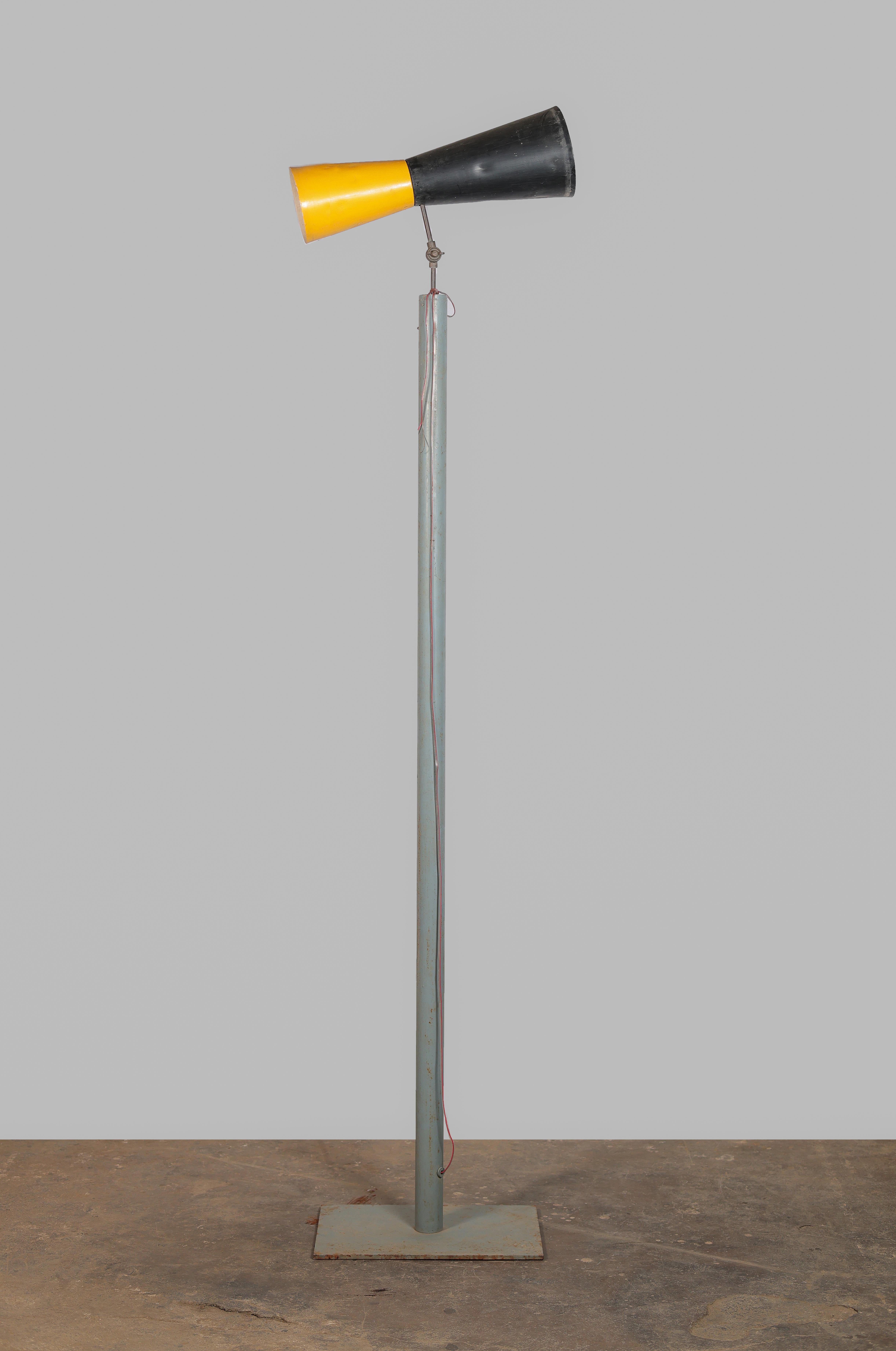 This lamp is not only a fantastic piece, it’s a rare collectors item. It is raw in its simplicity, embodying an expressing a nonchalance. It is a beautiful piece that could be put in a bedroom, in a walk way or as additional object in a living room.