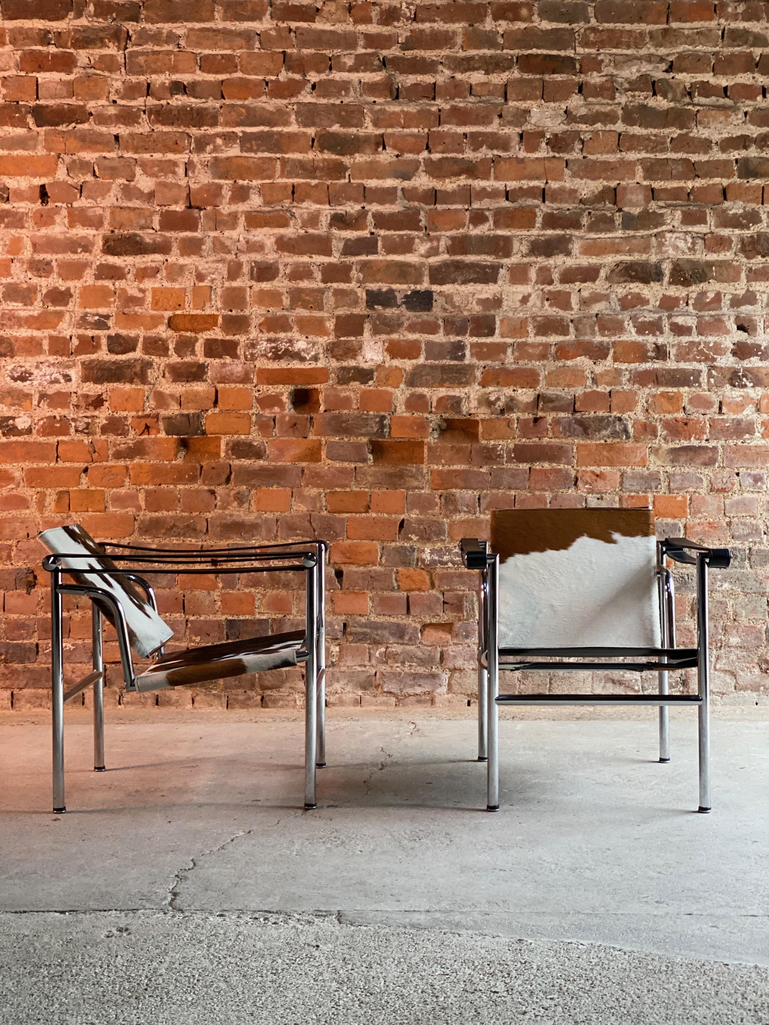 Le Corbusier LC1 Basculant chairs by Charlotte Perriand and Pierre Jeanneret

Fauteuil à dossier Basculant pair of original LC1 Basculant armchairs by Le Corbusier, Pierre Jeanneret, & Charlotte Perriand, finished in cow or pony hide on chrome