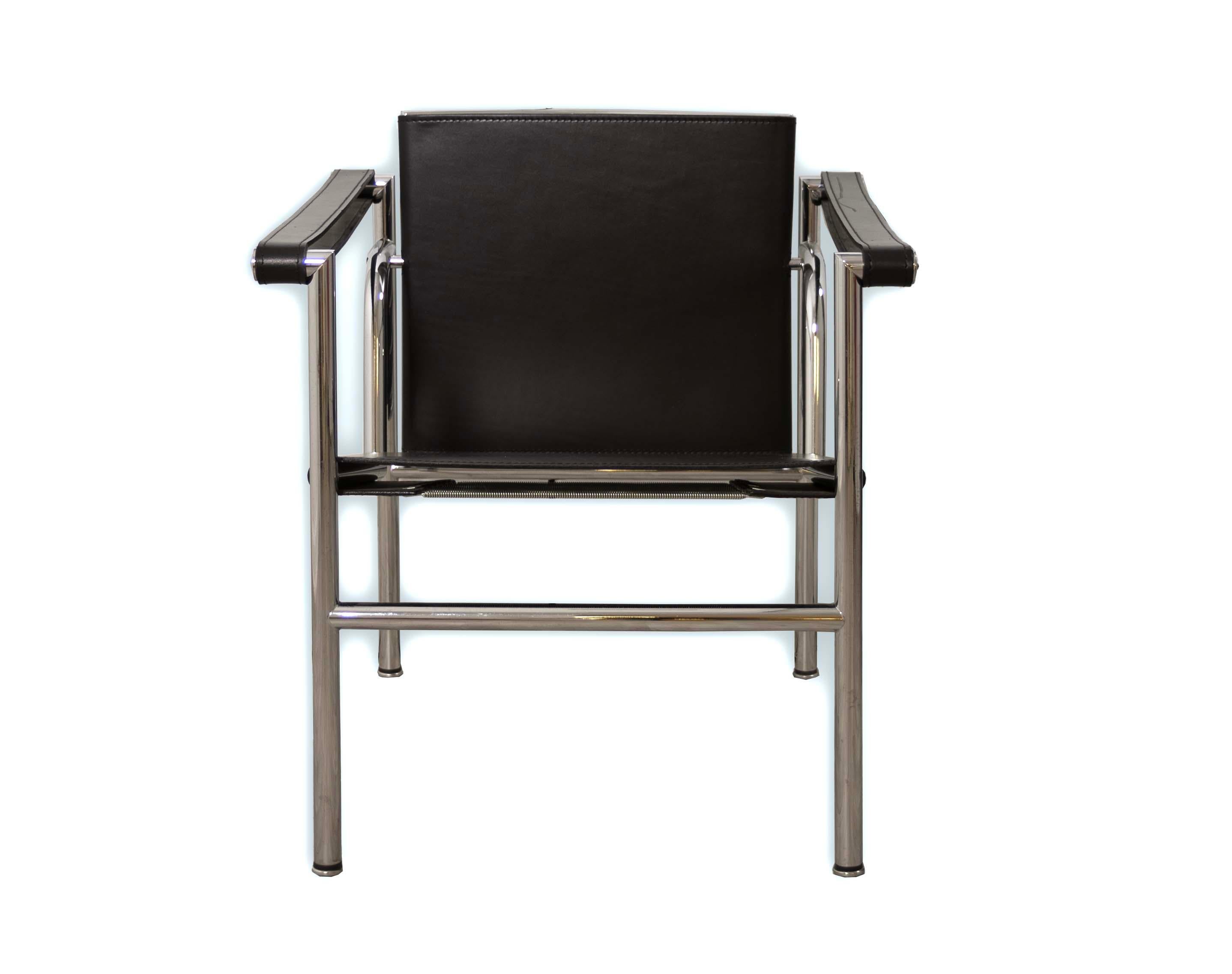 Embrace the timeless elegance of the Le Corbusier LC1 armchair, an exemplar of Mid Century Modern design. This sleek piece showcases a harmonious blend of high-quality black leather and lustrous chrome, delivering both style and comfort. Its refined