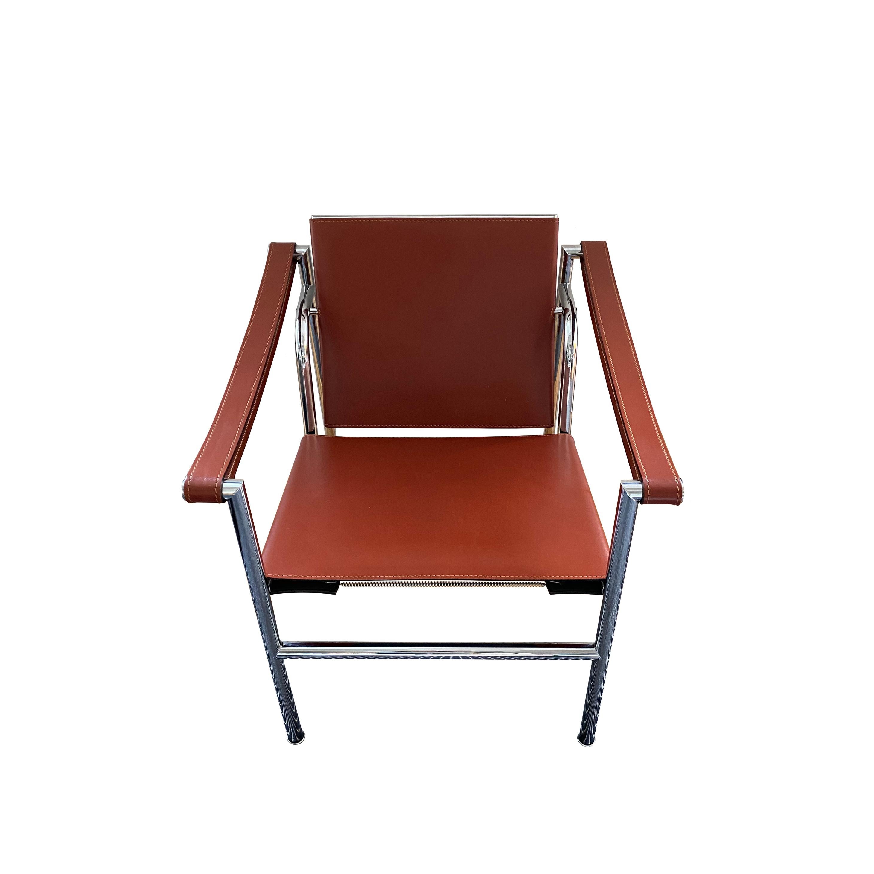 From the Lumifer Gallery Collection.

LC1 - Sling chair, originally titled Basculant, originally designed in 1928.

Leather, polished chrome steel.
Manufactured by Cassina
 
