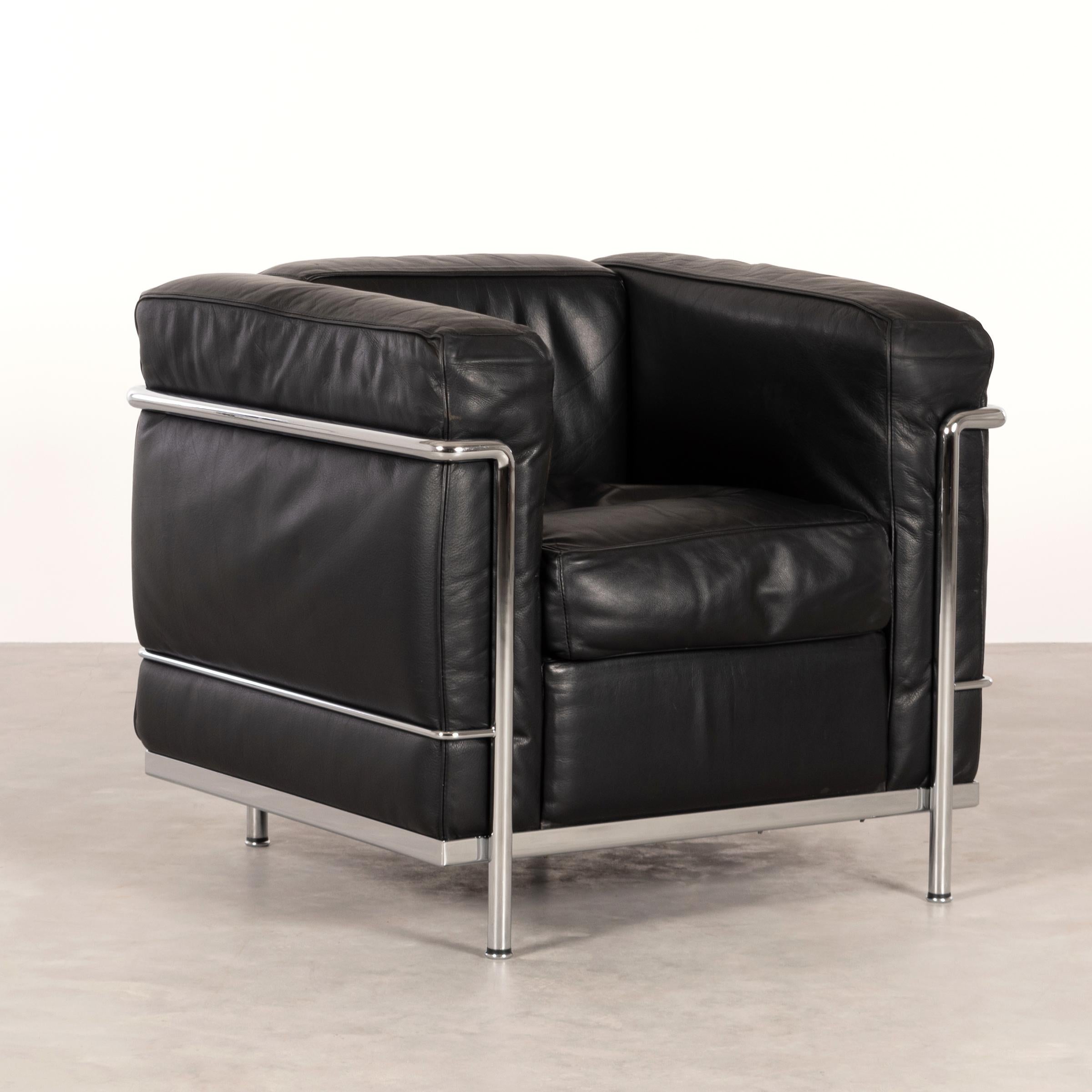 Iconic LC2 armchair designed by Le Corbusier / Pierre Jeanneret / Charlotte Perriand and produced by Cassina. chrome-plated steel frame with black leather cushions. Good original condition with sligth traces of use and patina. Signed with