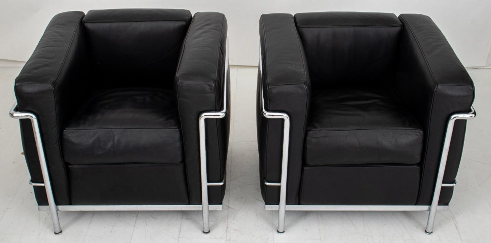 Cassina Le Corbusier (Swiss-French, 1887-1965) LC2 Easy Chairs (Fauteuil Grand Confort), a pair, 2, designed 1928, 1990s, of typical form with black leather and chrome fittings.

Dimensions:   26