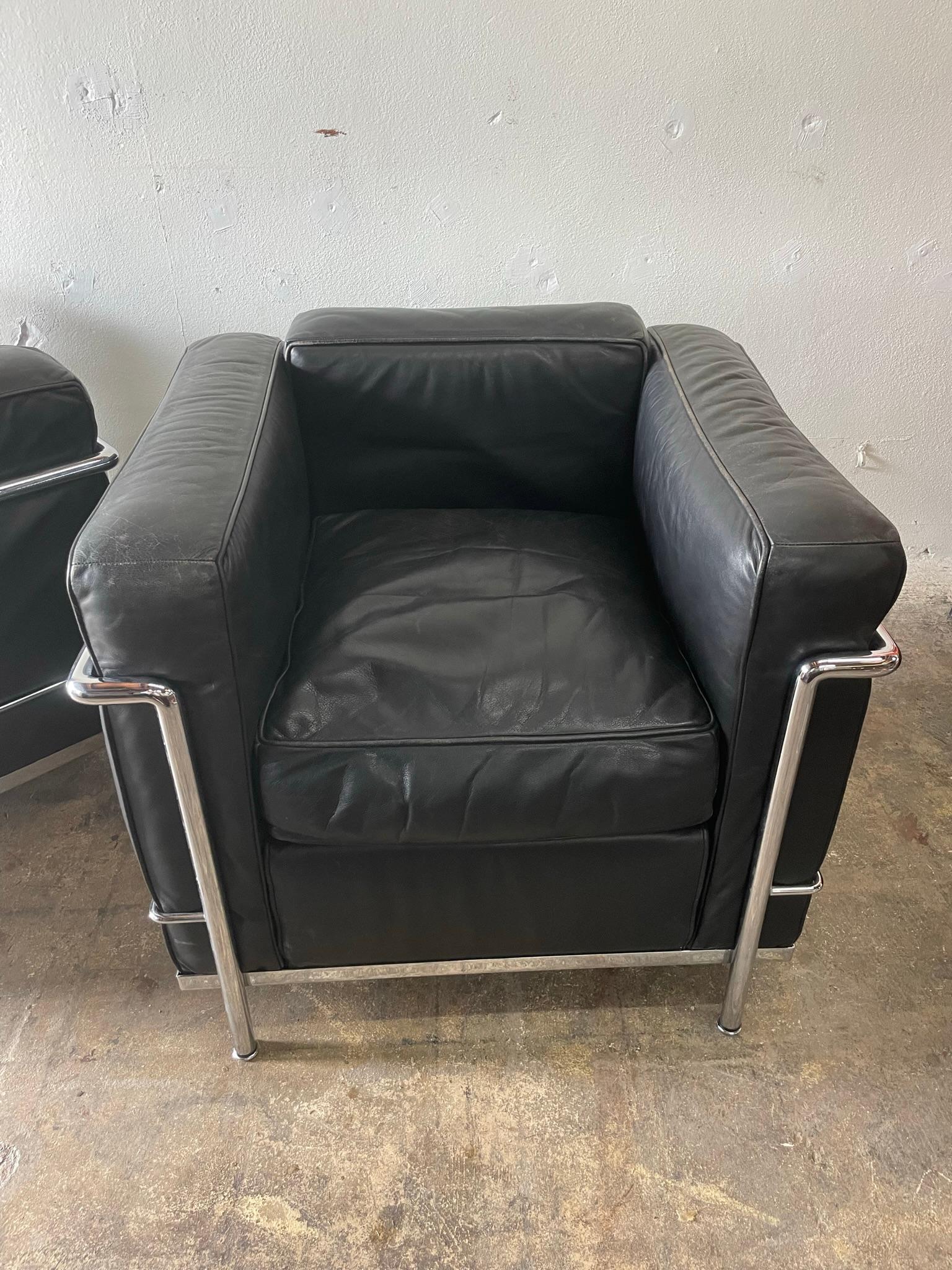 Pair of Authentic club chairs model LC2 in chrome designed by Le Corbusier and Charlotte Perriand and produced by Cassina.
Black leather. Stamped. Some patina on leather.
