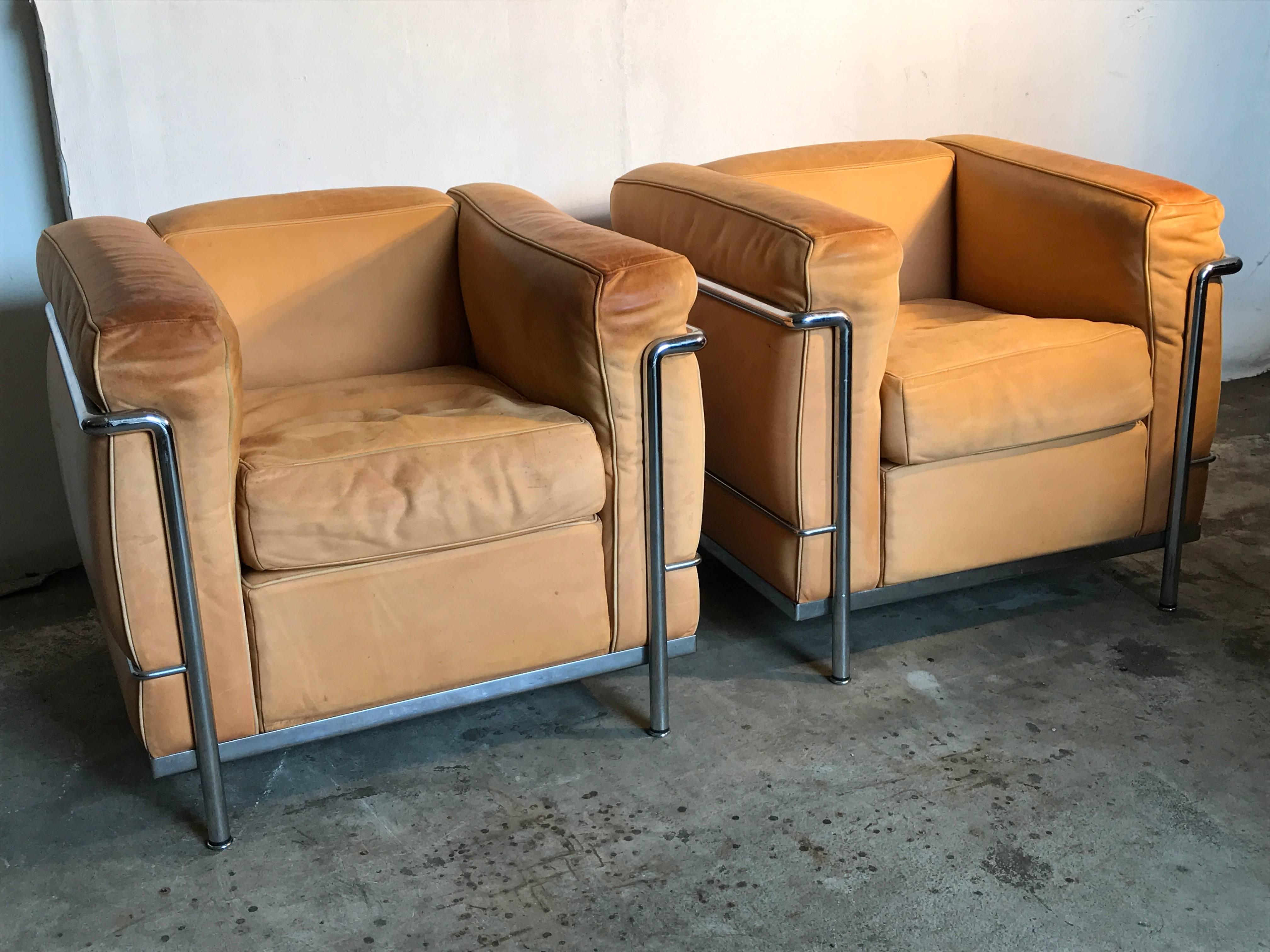 Two beautiful natural leather LC2 lounge chairs original by Cassina
design 1928 by architect Le Corbusier
Leather very nice patinated 
production from the late 1980s
menufacter marked ingraved in the metal frame.