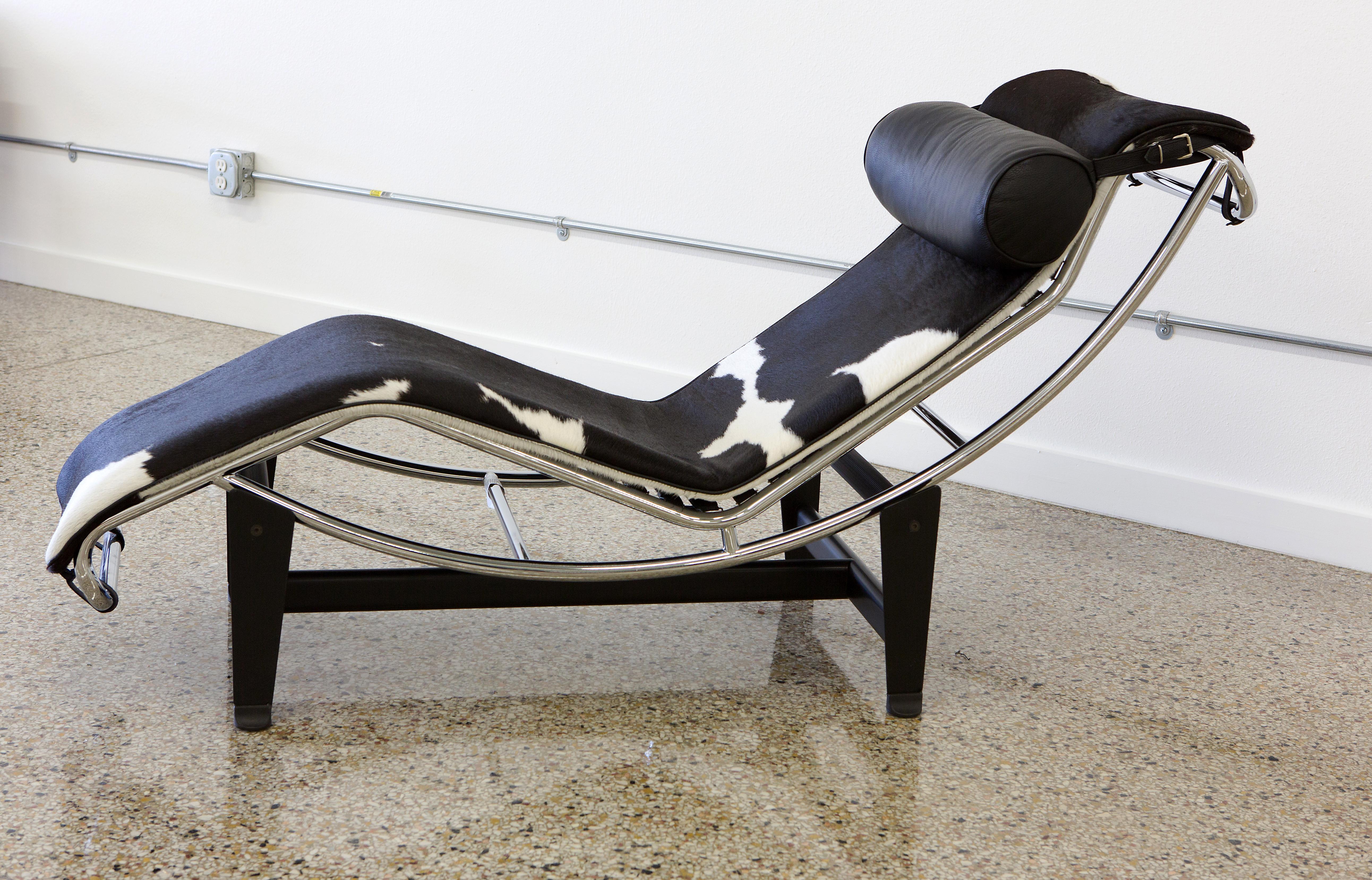 Le Corbusier LC4 chaise by Gordon International. Natural hide on chrome frame mounted on Industrial black painted steel base. This Bauhaus Classic debuted in 1928. The so-called relaxation machine, with its two-piece design, shapes itself to the