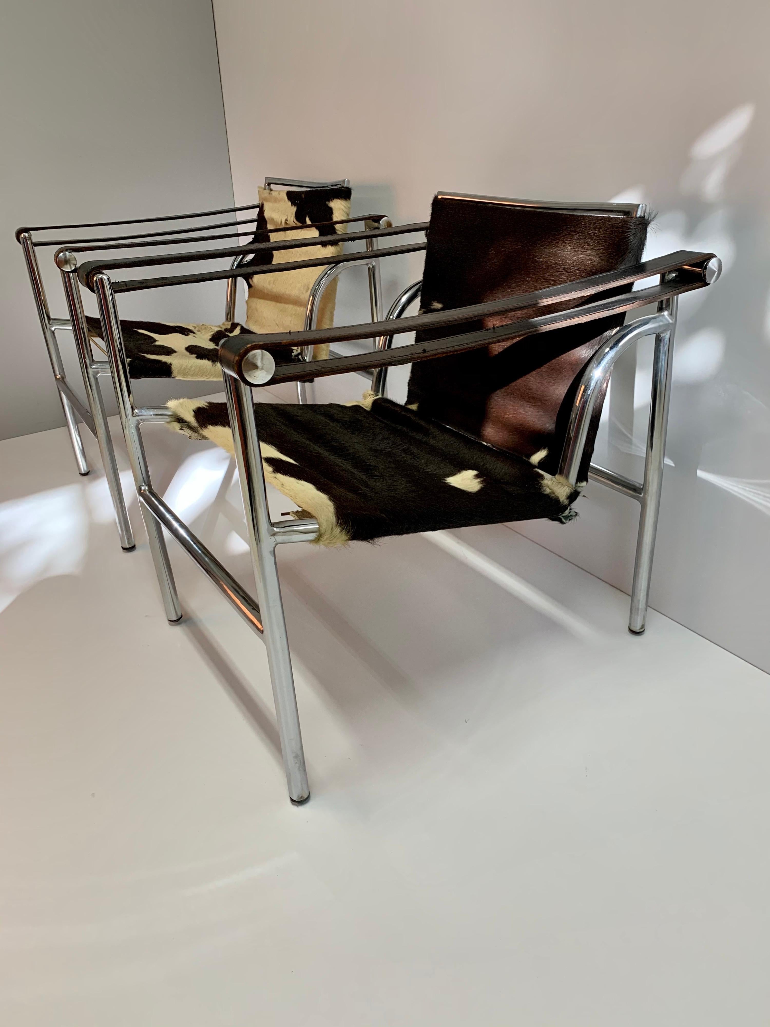 LC1 armchairs, with chromed steel structure, cow leather back and seat and armrests in black leather.
Offered in as-found condition, some details of wear on the leather an miss a pair of support springs. 
Detailed photos upon request.