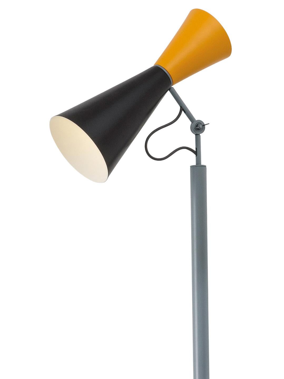 Le Corbusier 'Parliament' floor lamp for Nemo in black and yellow. 

Le Corbusier designed the Parliament lamp for the Chandigarh Parliament in India. This iconic floor lamp features a two-way light source, with a dual-cone design executed in
