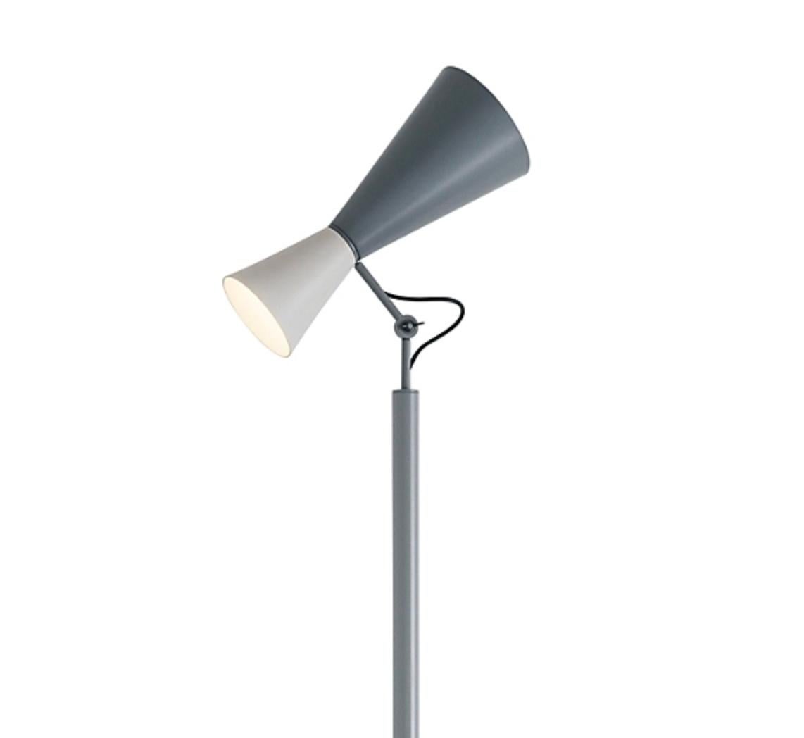 Le Corbusier 'Parliament' floor lamp for Nemo in white and gray. 

Le Corbusier designed the Parliament lamp for the Chandigarh Parliament in India. This iconic floor lamp features a two-way light source, with a dual-cone design executed in painted