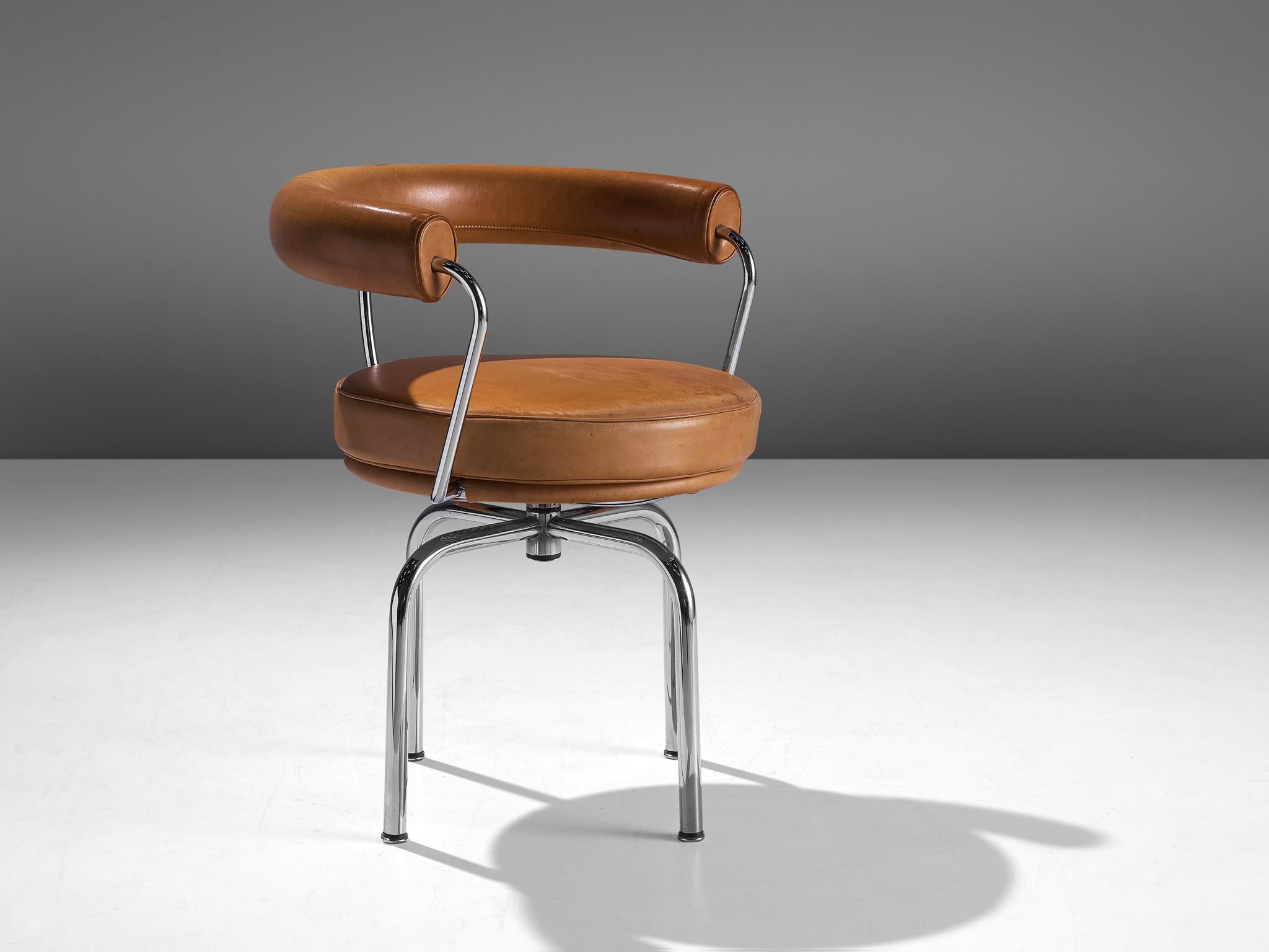 Le Corbusier, Charlotte Perriand and Pierre Jeanneret for Cassina, 'LC7' swivel chair, leather and chromed steel, Italy, design 1927, production later.

A Lightly patinated LC7 swivel chair in cognac leather and chromed, tubular steel. The LC7