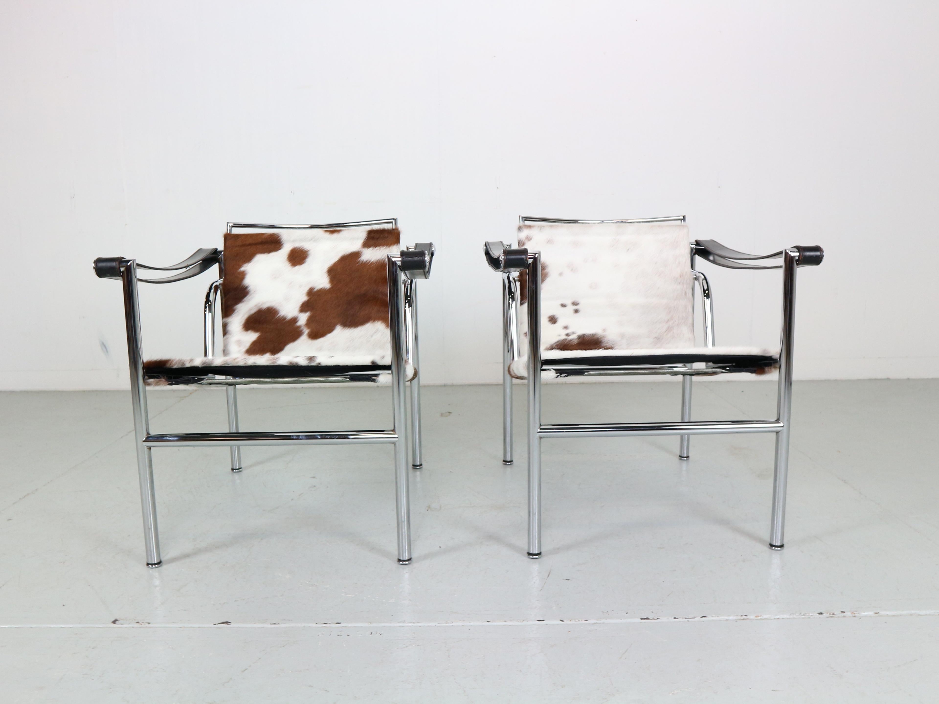 Beautiful set of 2 armchairs designed by Le Corbusier, Pierre Jeanneret and Charlotte Perriand and manufactured for Cassina, famous Italian furniture manufacture in 1970s period.
Both chairs are original signed. Model number LC1.
Chrome tubular