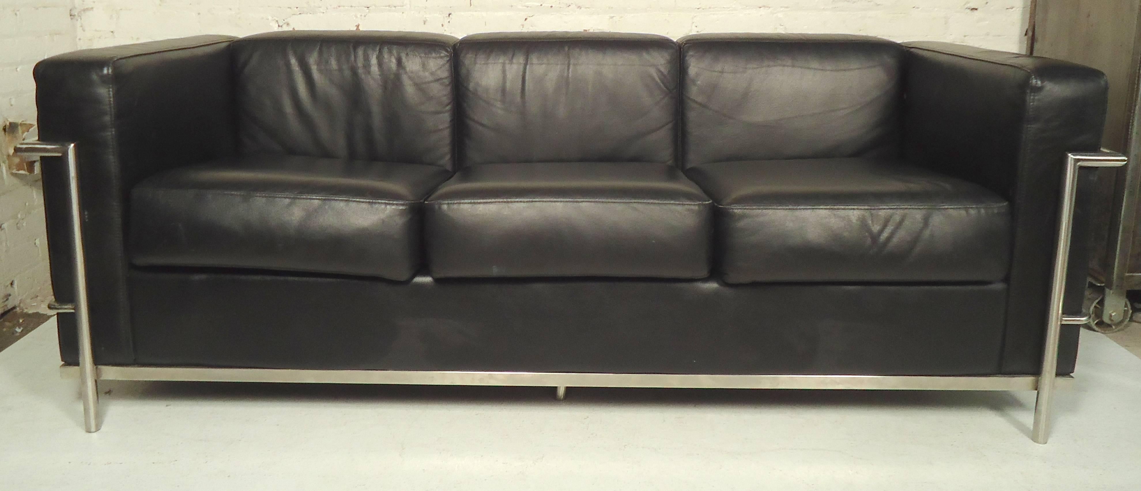 Mid-Century Modern style black sofa with chrome frame. Comfortable three seat sofa in the style of Cassina.

(Please confirm item location - NY or NJ - with dealer).
  