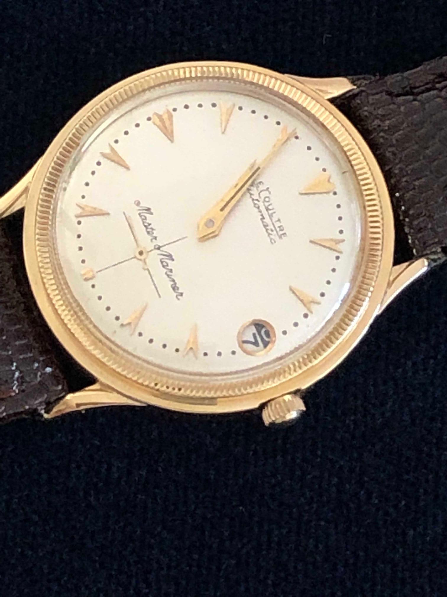 An unusual find, a Lecoultre automatic men’s 14-karat gold watch with case and papers. Measures 34.5