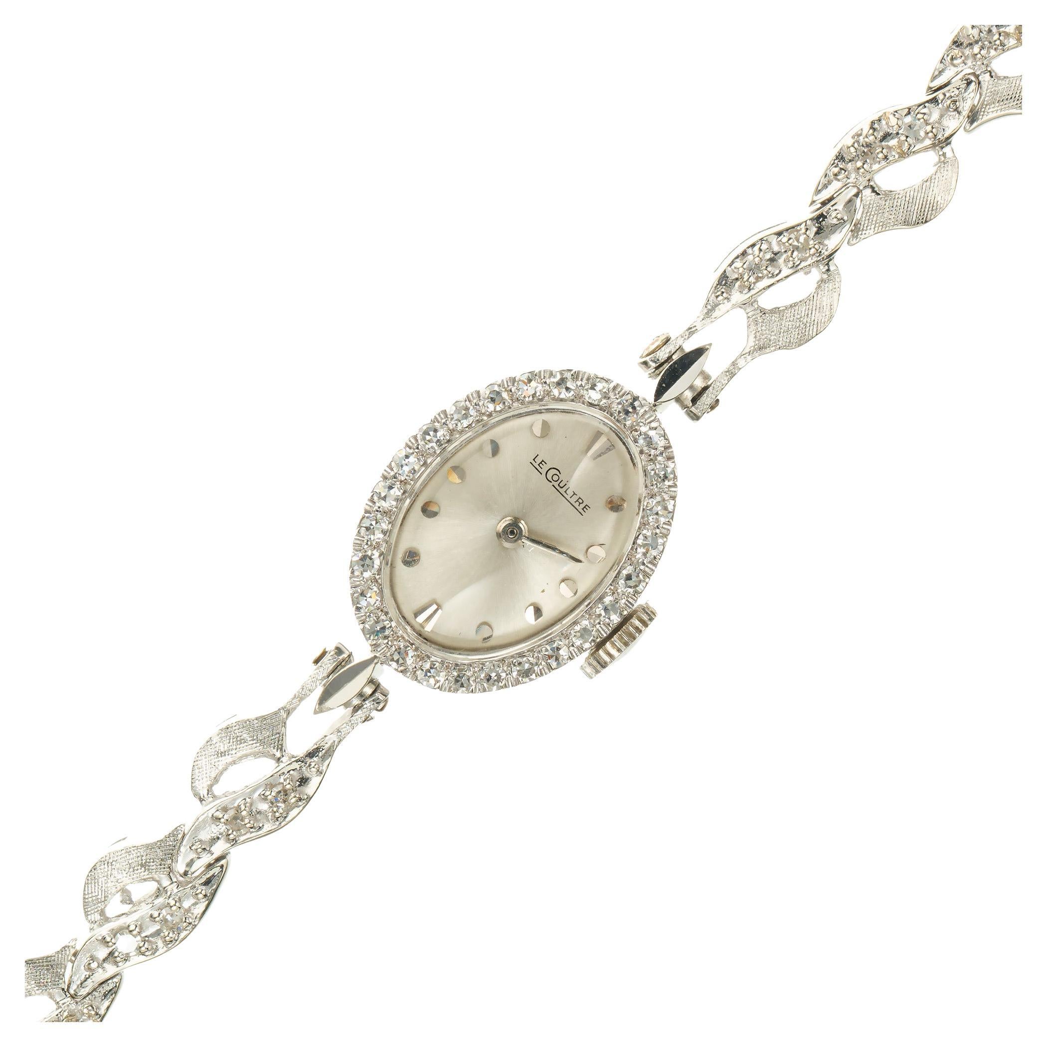 Mid-Century 1960's Le Coultre lady's diamond wristwatch. Oval diamond bezel with accent diamonds along the bracelet. 6.50 inches long. 14k white gold. Fully serviced. A beautiful representation of the 1960's. 

54 single cut diamonds, approx. total