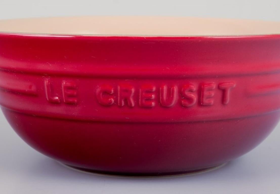 French Le Creuset, France. Set of five red stoneware bowls. 21st c. For Sale