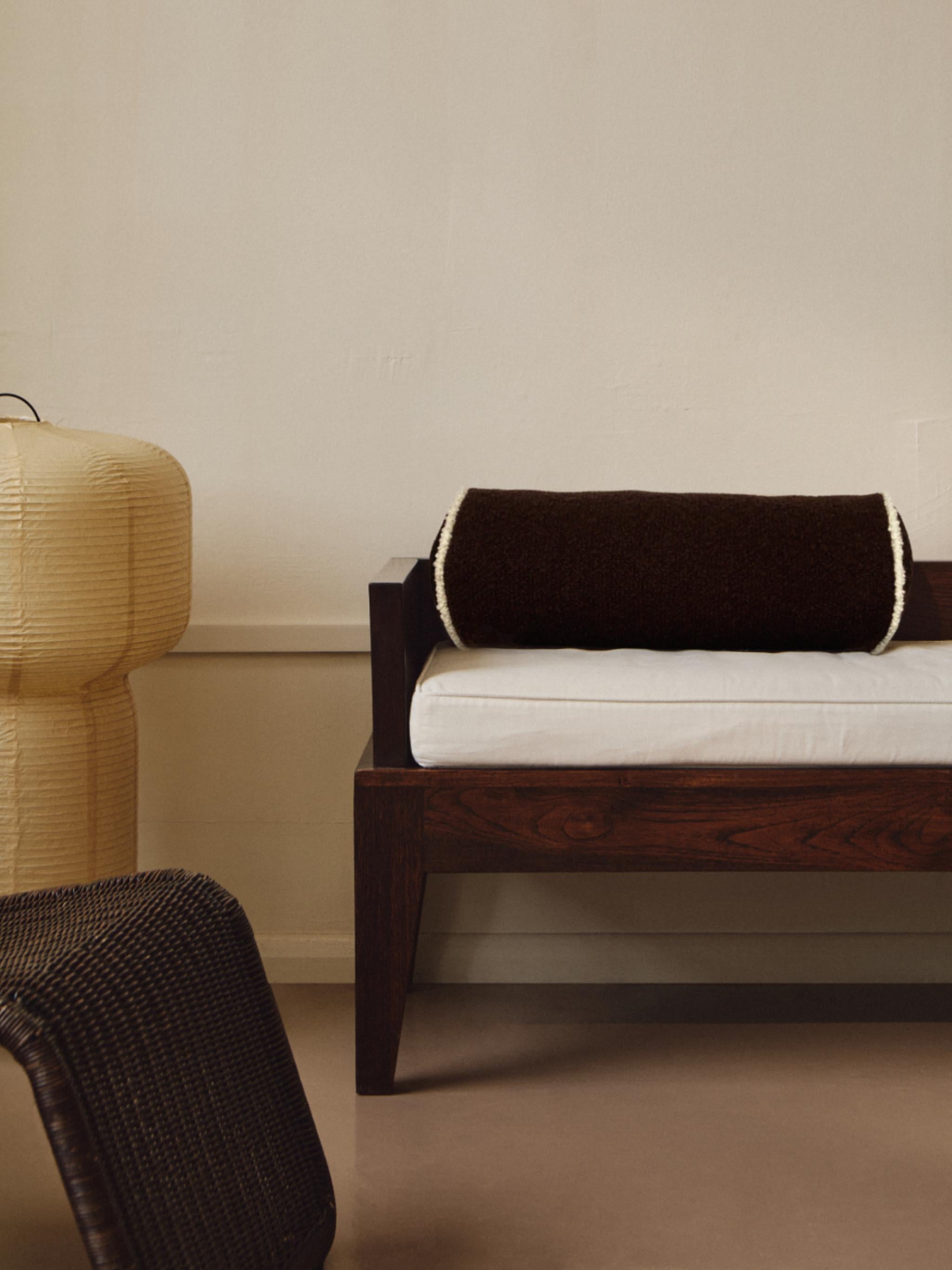 Working with luxurious heavy weight wool bouclé fabric woven in a traditional fabric mill in Scotland, this vintage-inspired Le Cylindre piped bolster cushion reflects the brand's affinity for modernist 20th-century design. Suited to both classical