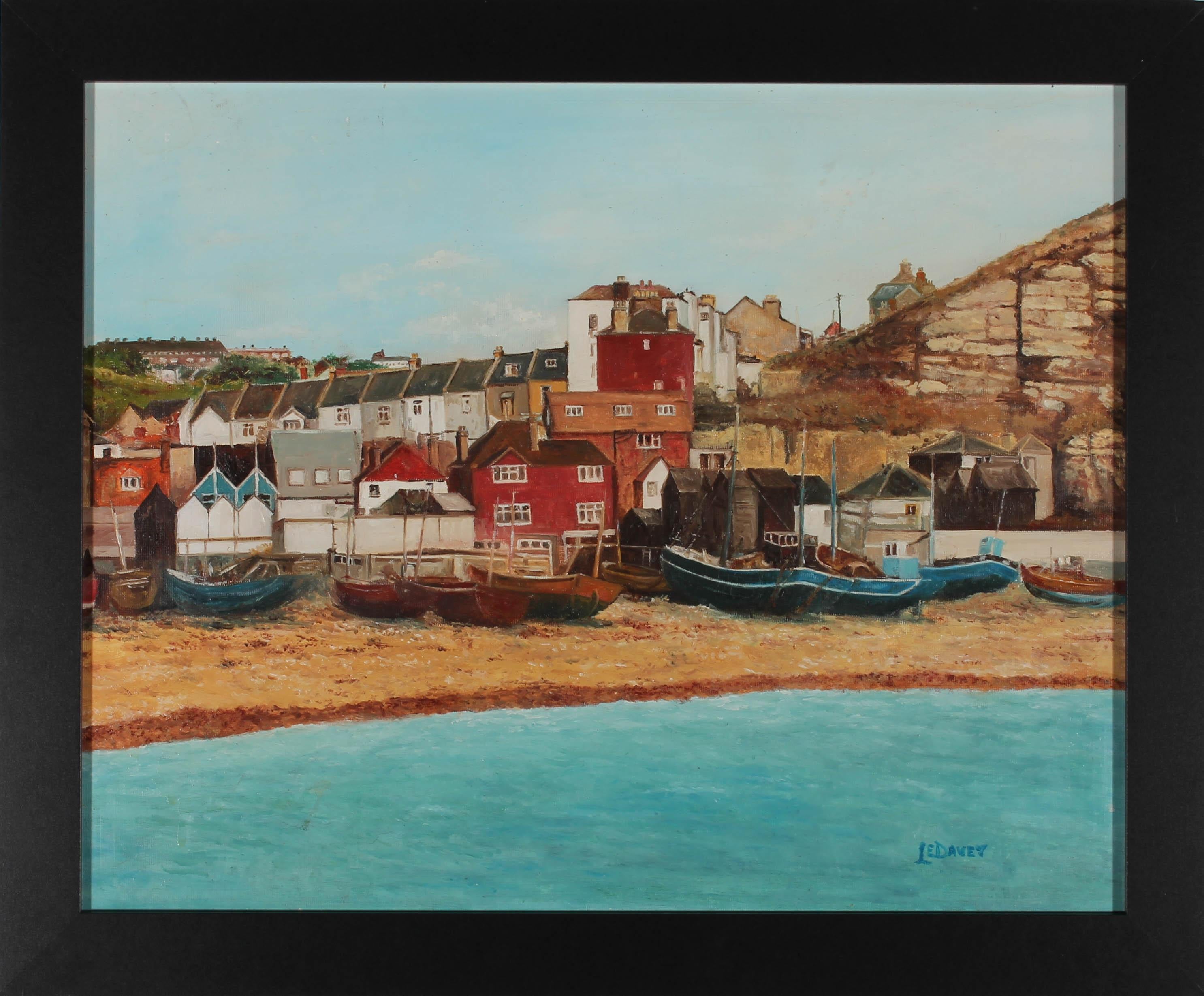 A charming scene of a coastal town in Cornwall with various boats moored on the beach. The artist has signed to the lower right and the work has been presented in a sleek black frame. On canvas laid to board.
