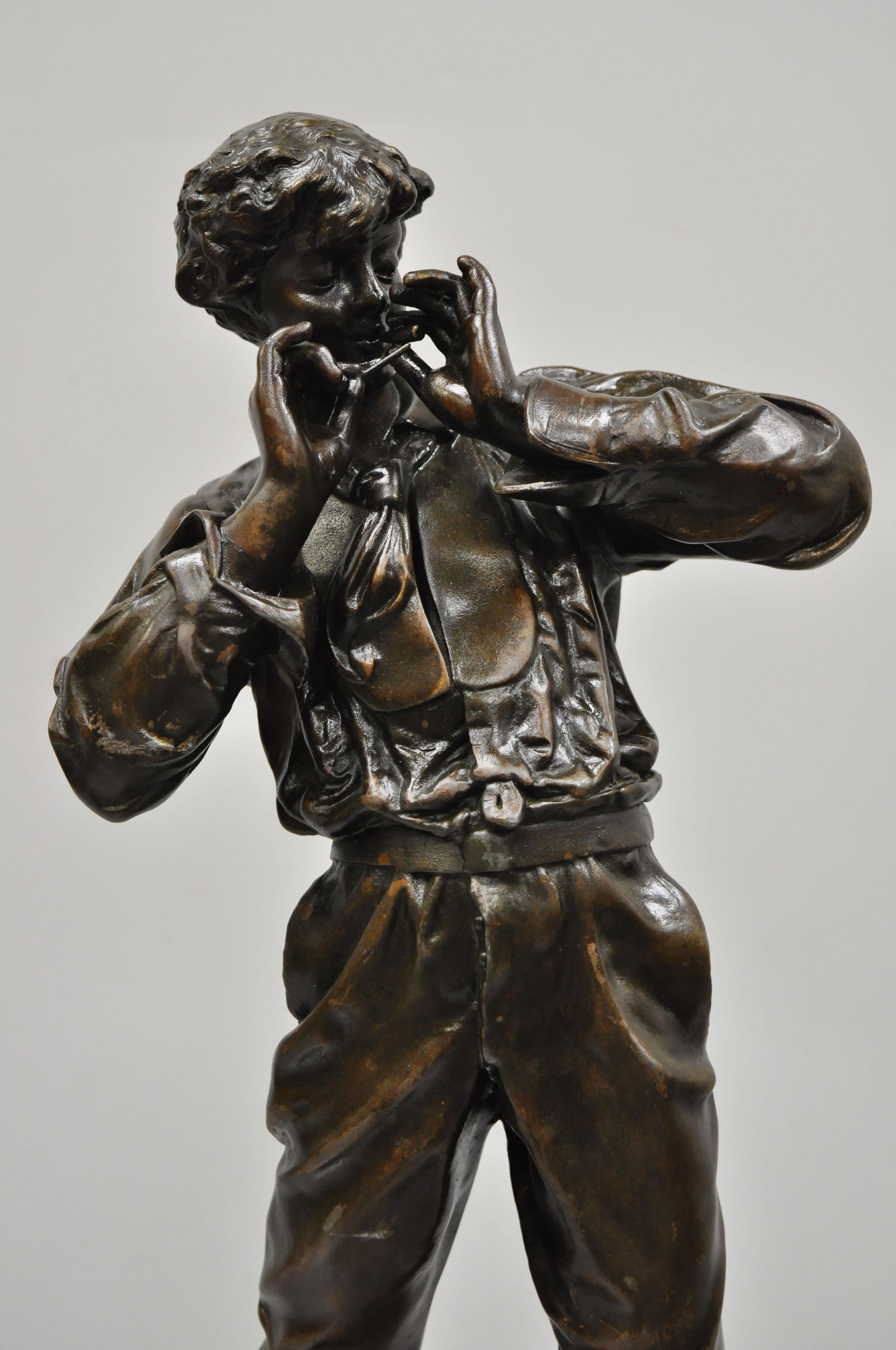 Le Fumeur French Spelter statue sculpture of young man smoking by Charles Masse. Item features brass plaque reads 