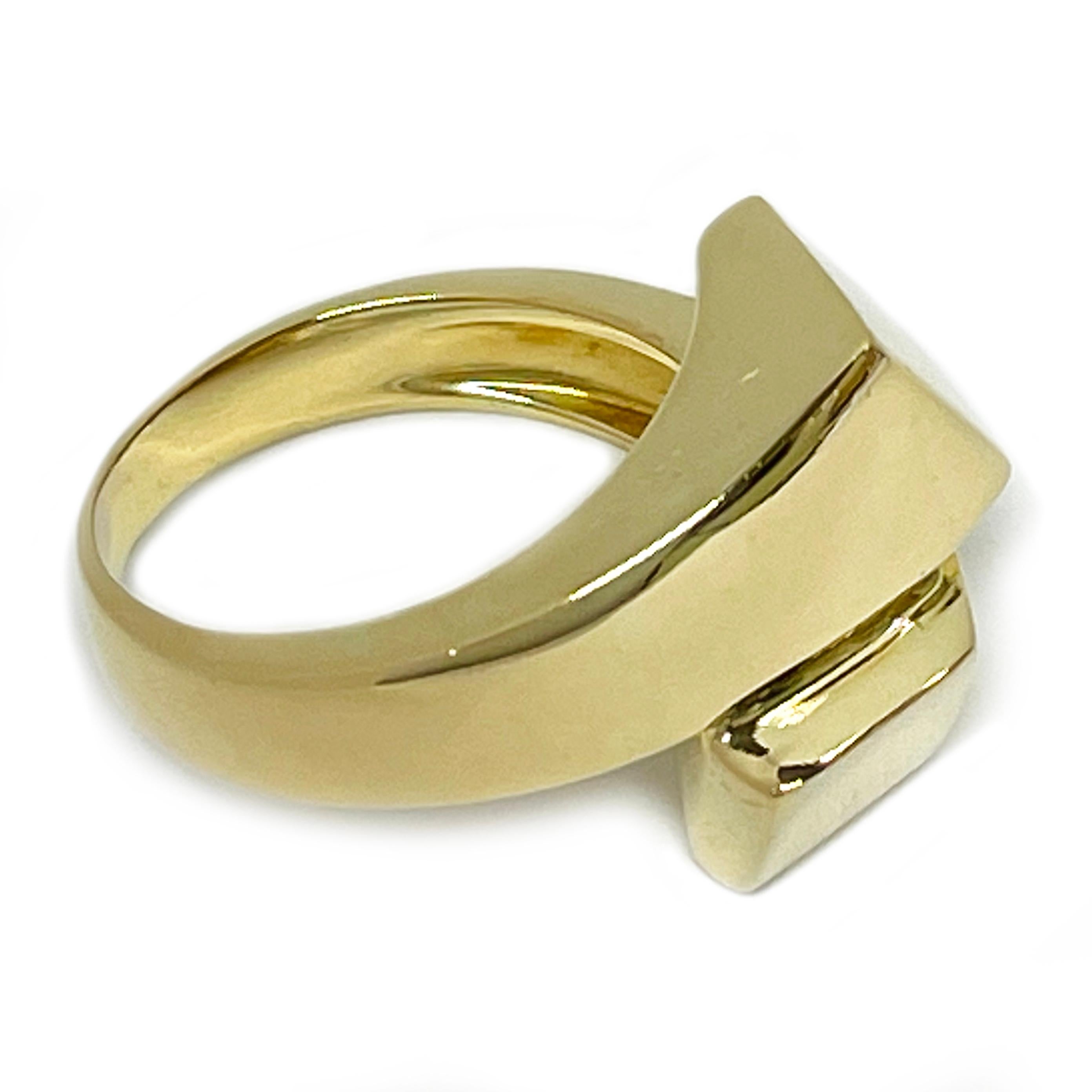 18 Karat Yellow Gold Bypass Ring. The ring features two gold tube-like sections in a bypass form in the front part of the ring. Stamped on the inside of the band is (star) 314 VI Le-Gi 750 and Le-Gi's sun and rays logo. The VI marking means the ring