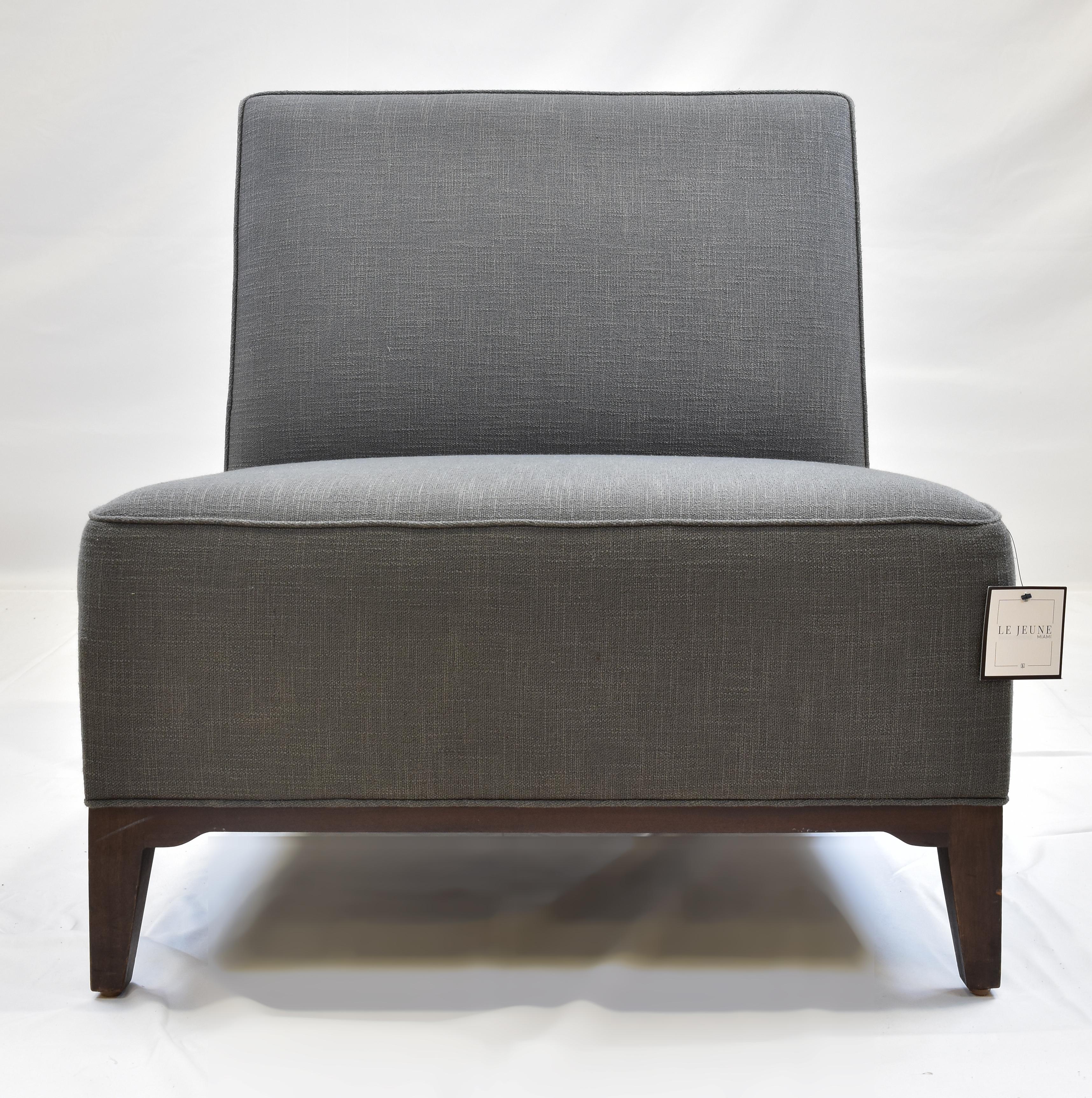Le Jeune Upholstery Loft Slipper Chair Showroom Model

Offered for sale is a Le Jeune Upholstery LOFT	C6.932 Slipper Chair Showroom Model. This	slipper chair is medium-scaled with a tight seat and back sitting style. It has a walnut wood base and