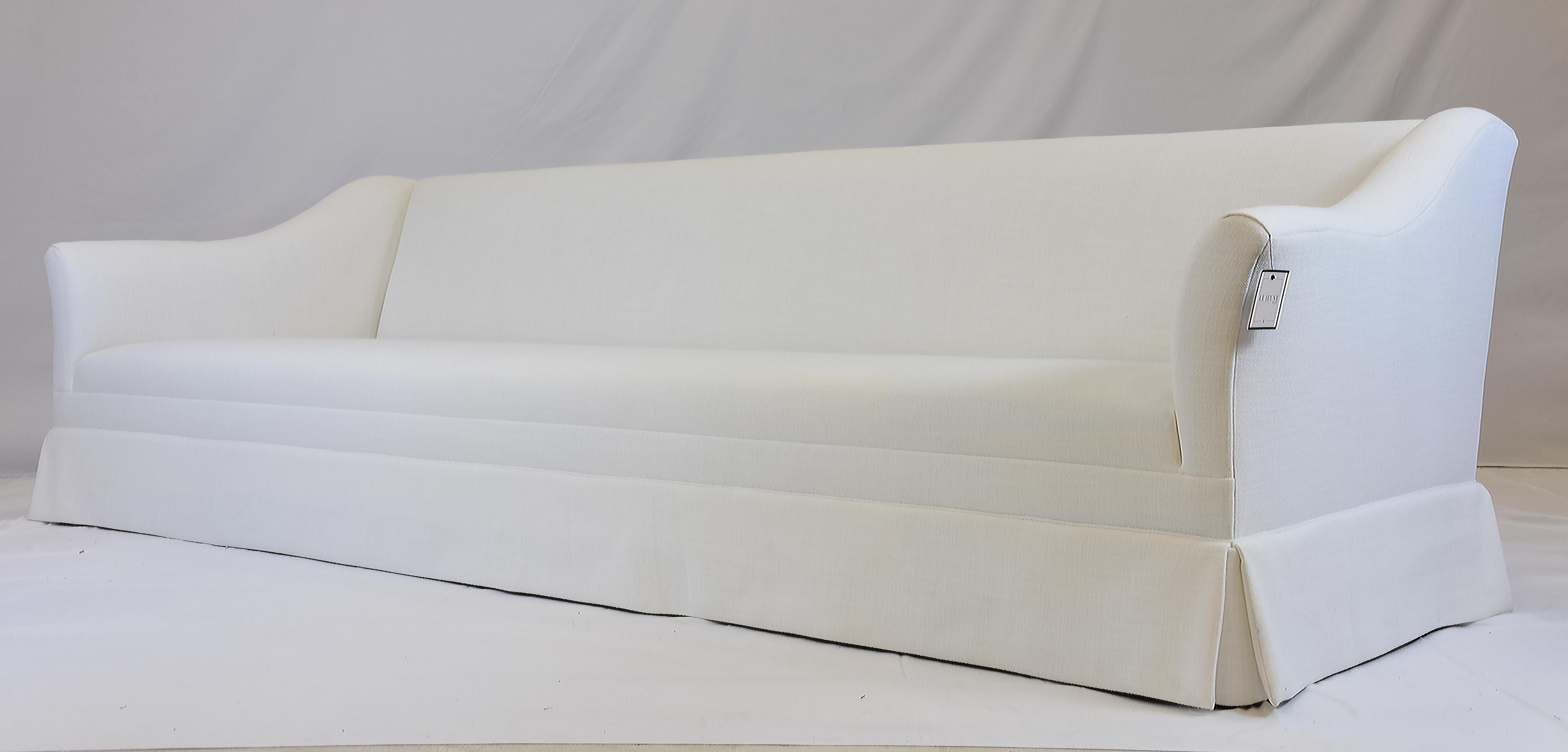 Le Jeune Upholstery Lucca Sofa Showroom Model in White Linen

Offered for sale is a Le jeune Upholstery LUCCA S10.923	sofa showroom model. This long sofa has an elegance to its minimalistic design.  From a tight seat and back concept, to a low