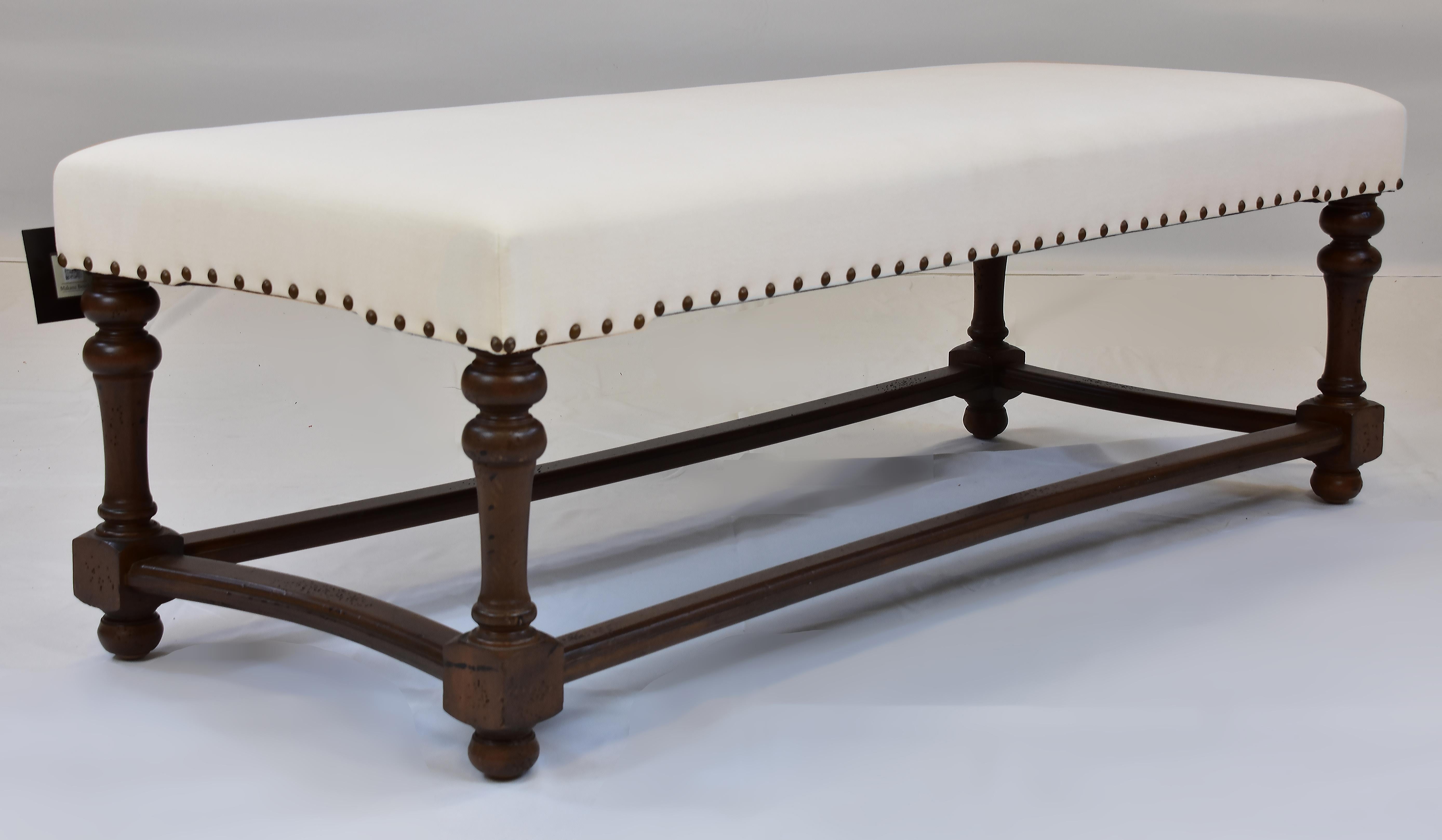 Le Jeune Upholstery Makana Bench Showroom Model with Nail Heads, Ivory Linen

Offered for sale is a Le Jeune Upholstery lMAKANA	B4.923 Bench showroom floor model.	This is a classic Bench style with traditional turned legs and curved stretchers. The